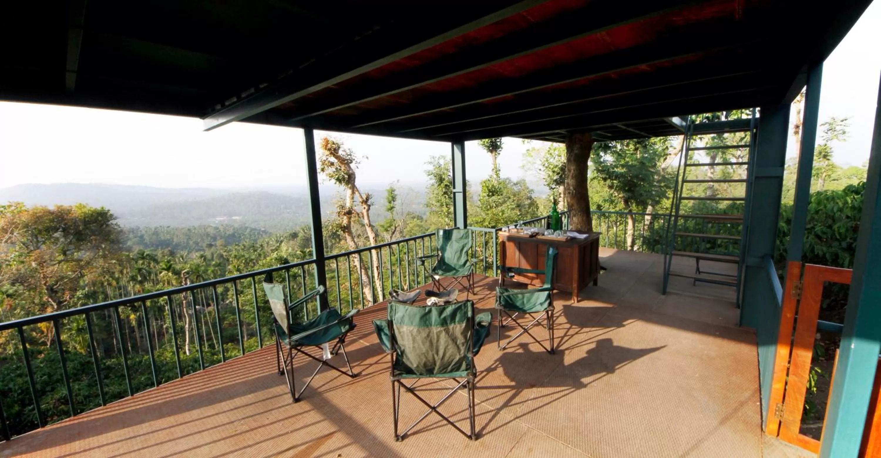 Seating area, Balcony/Terrace in Marmalade Springs Resort Wayanad