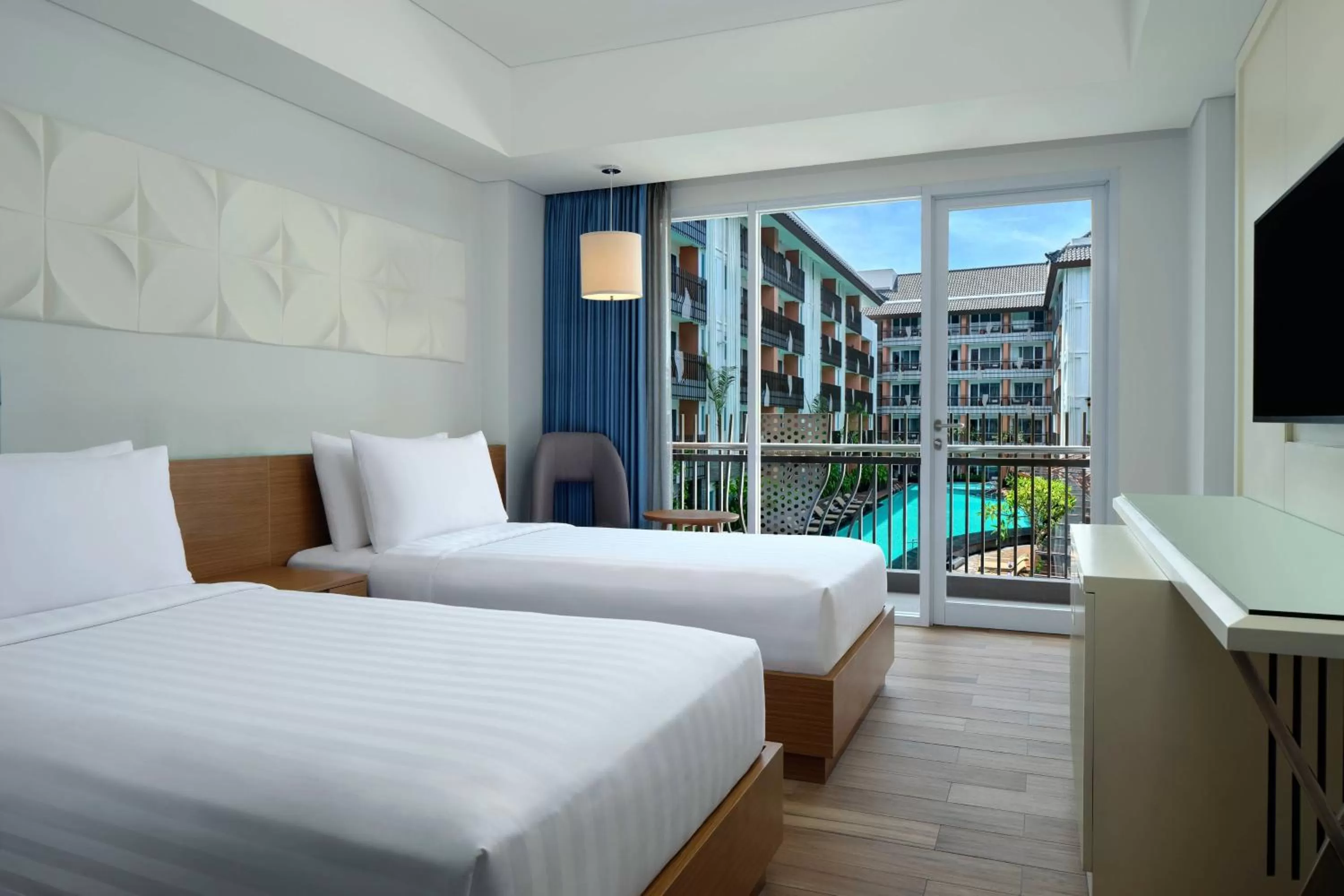 Swimming pool, Bed in Fairfield by Marriott Bali Kuta Sunset Road