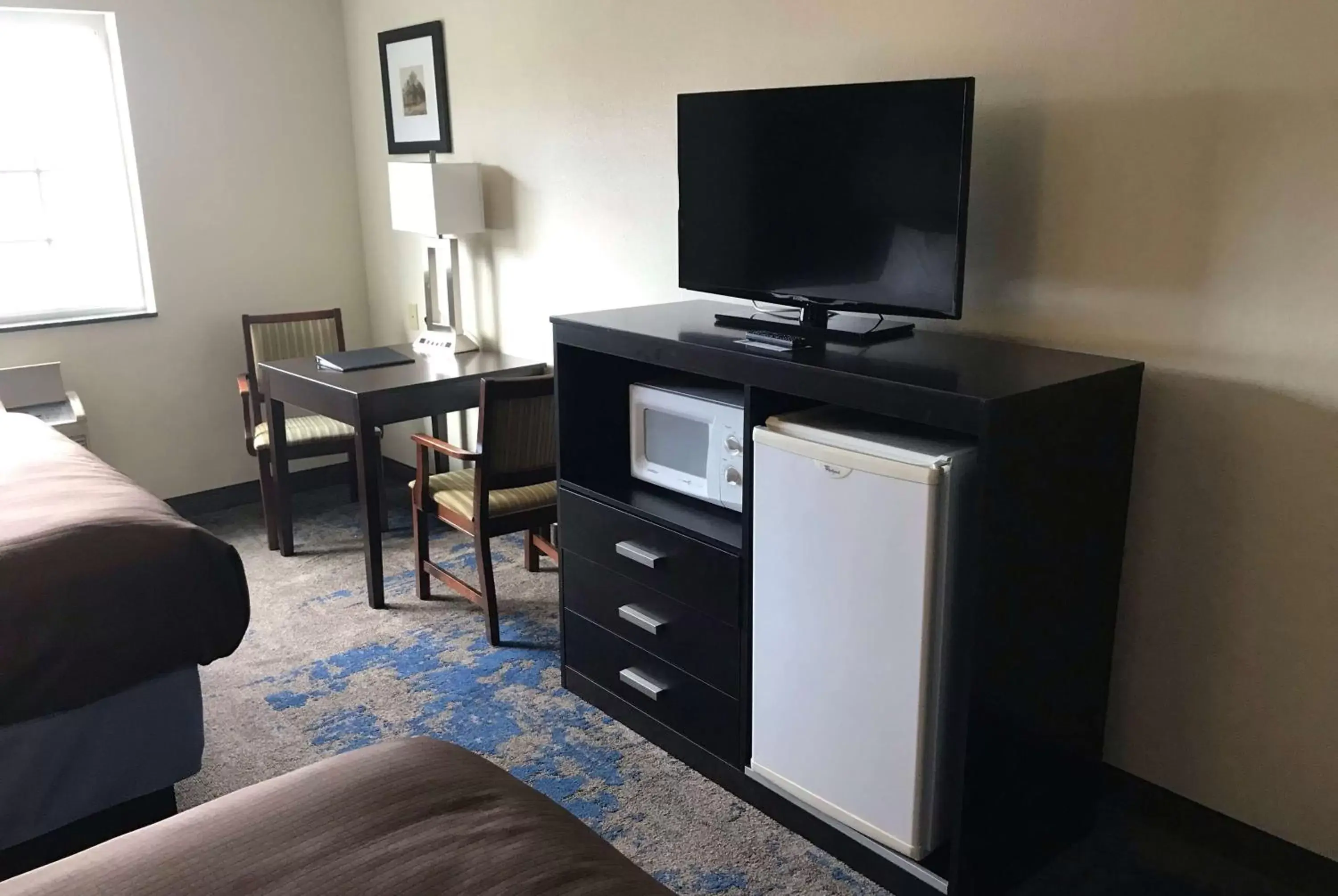 Photo of the whole room, TV/Entertainment Center in AmericInn by Wyndham Maquoketa