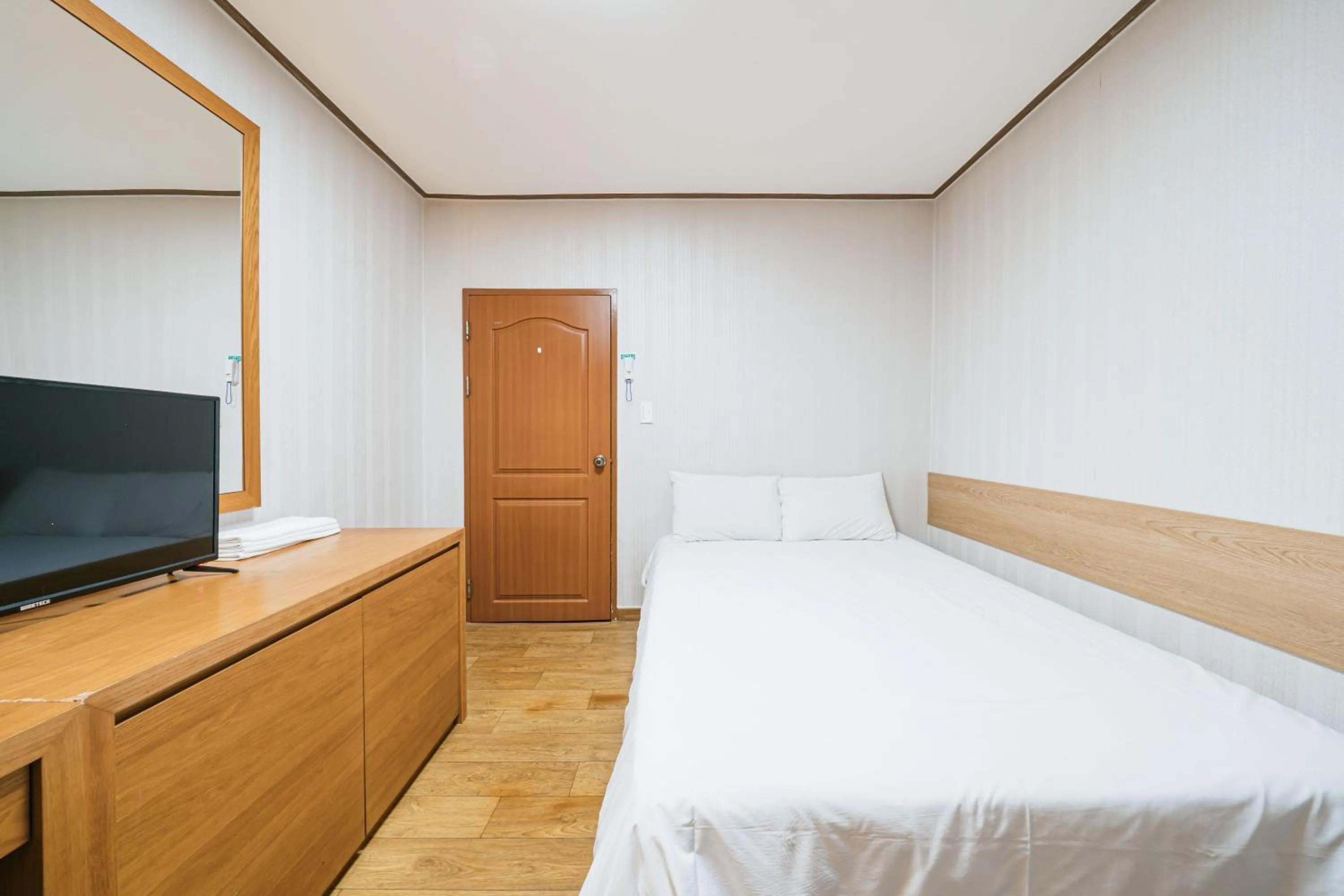 Bed in Jeju Miracle Hotel