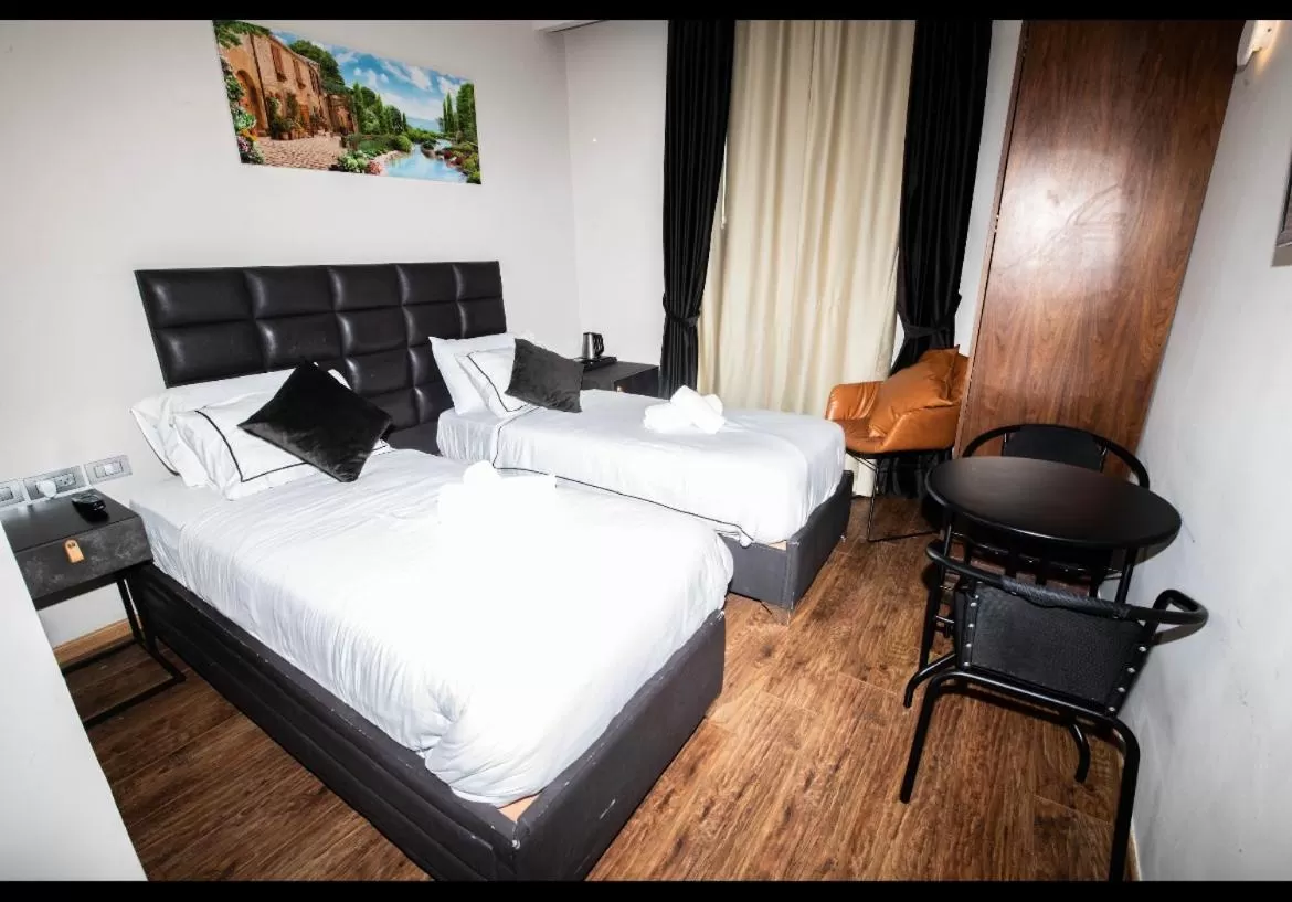 Seating area, Bed in The MAZ Jerusalem