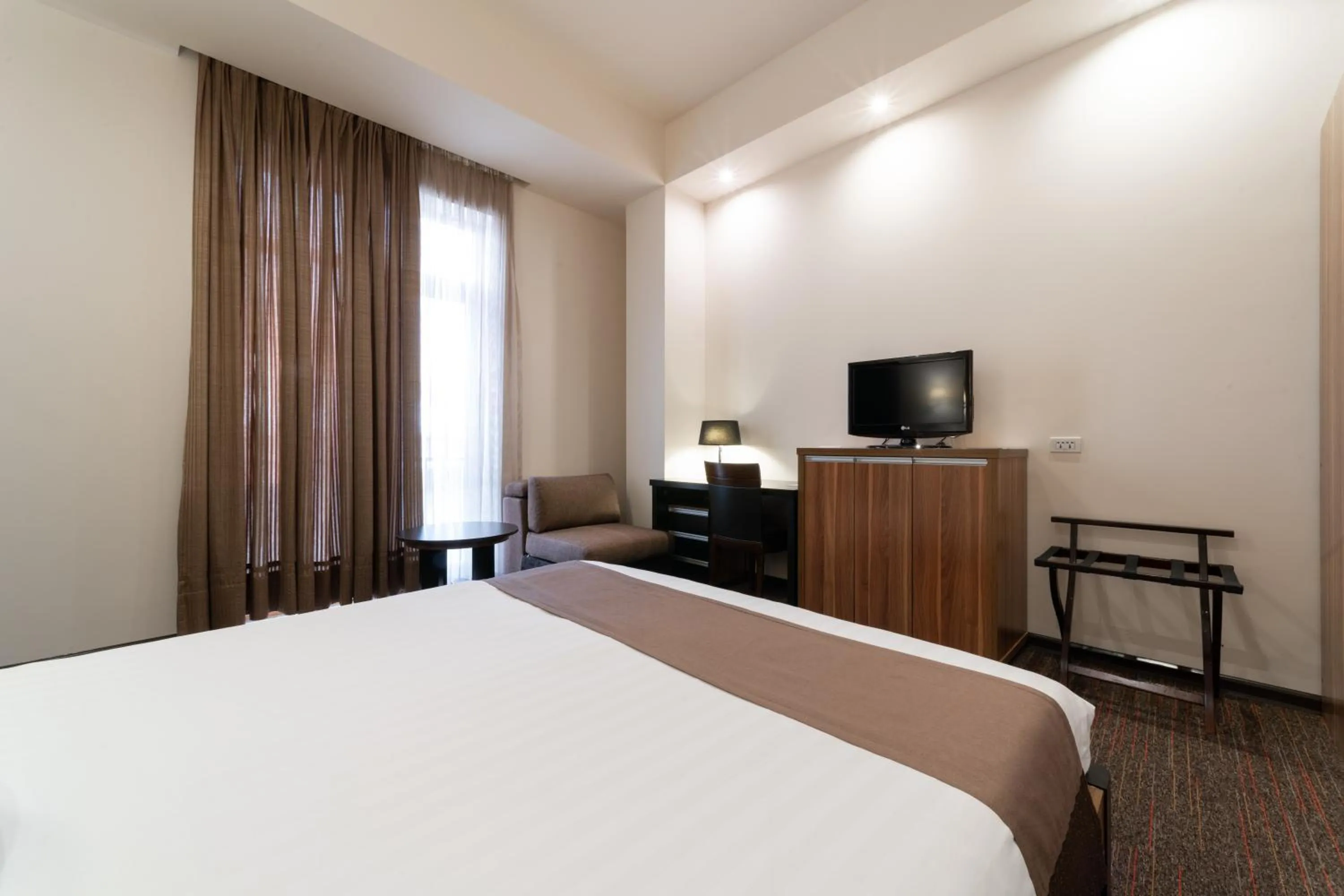 Bed in Bass Boutique Hotel