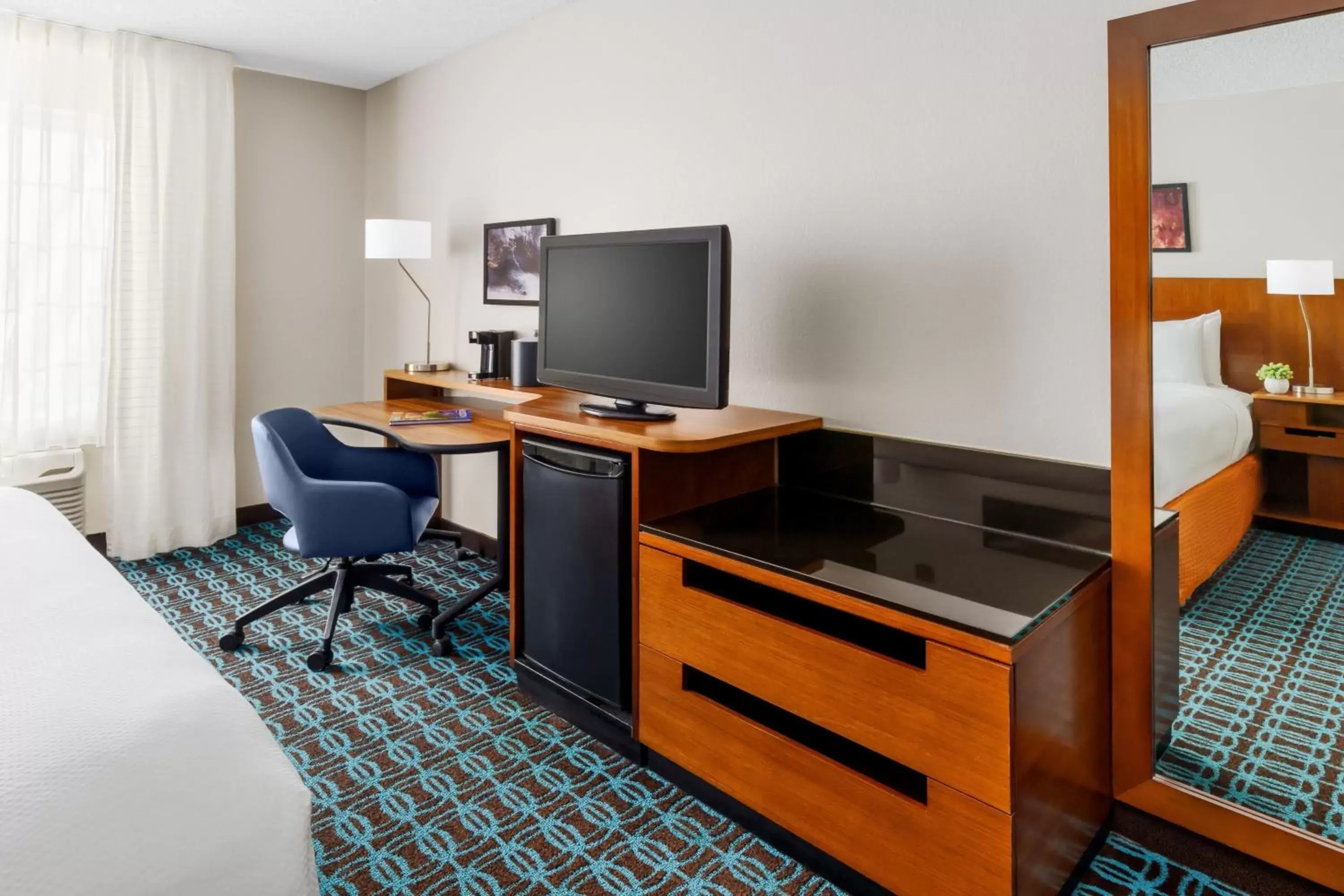 Photo of the whole room, TV/Entertainment Center in Fairfield Inn and Suites by Marriott Houston The Woodlands