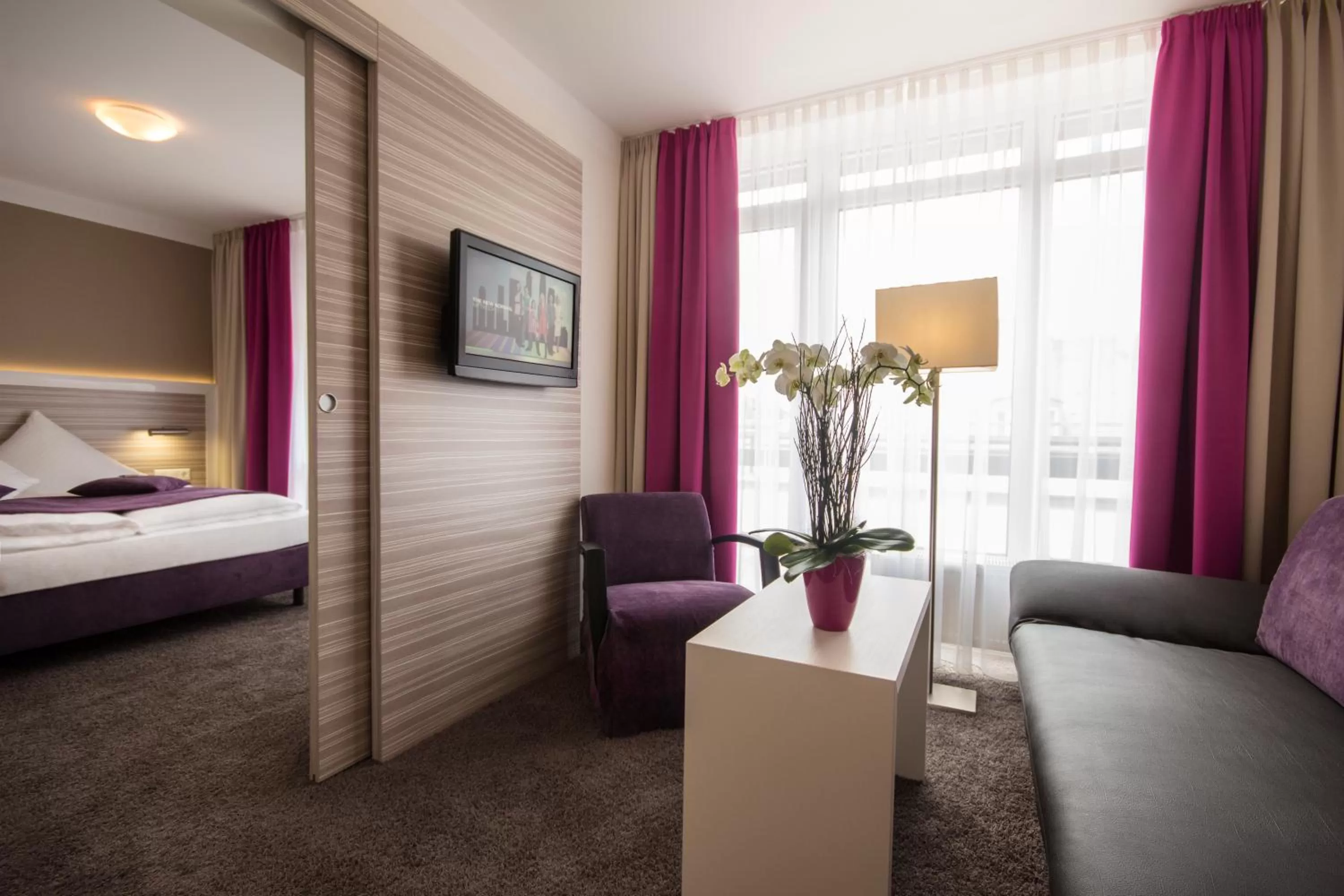 Living room, Bed in Hotel Mirabell by Maier Privathotels