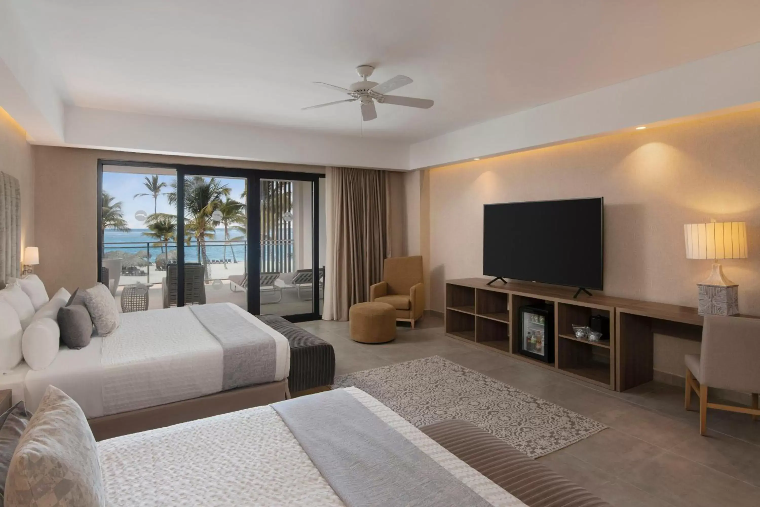 Photo of the whole room, TV/Entertainment Center in Serenade Punta Cana Beach & Spa Resort
