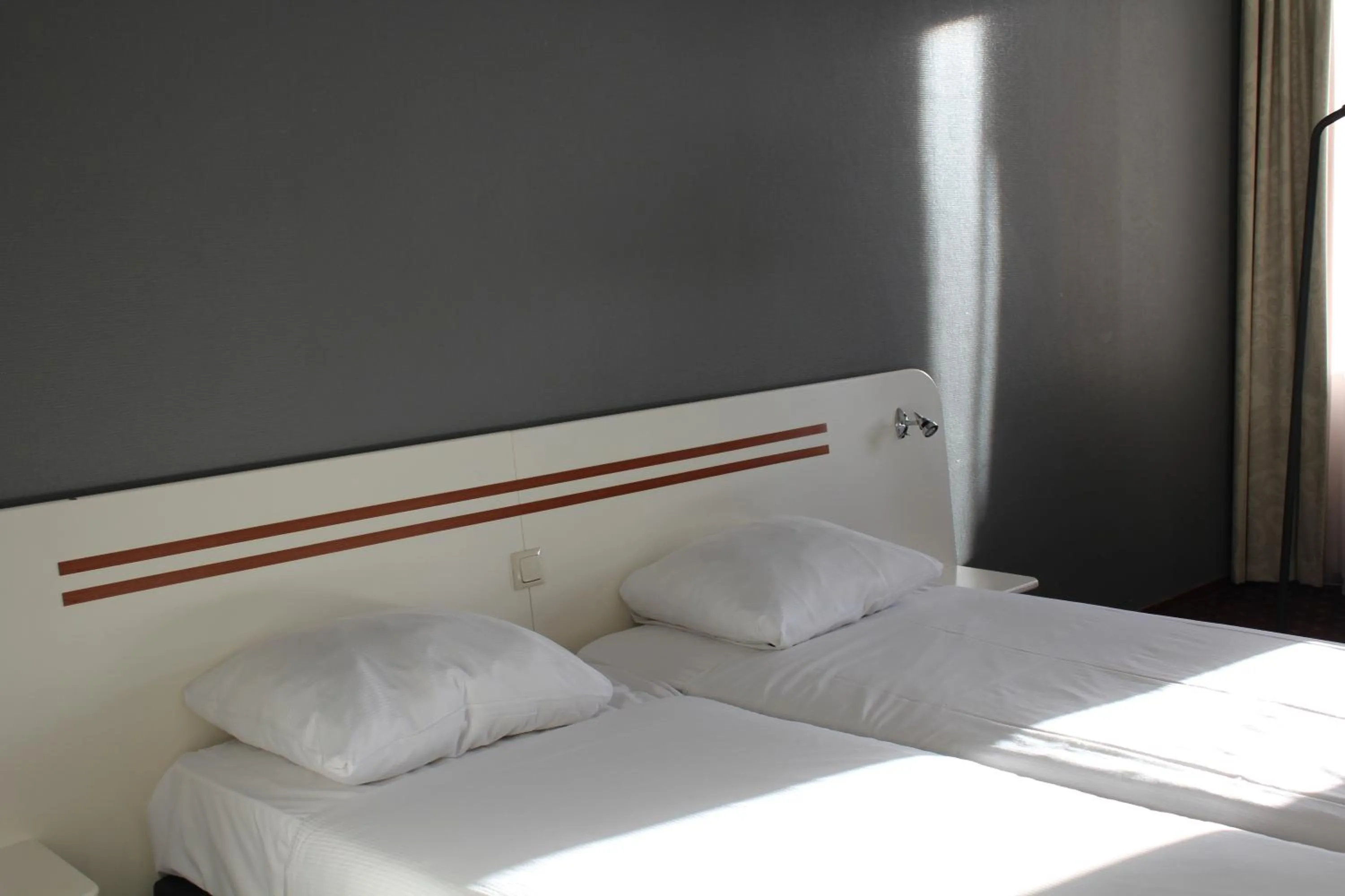 Bed in Fletcher Stadshotel Den Haag