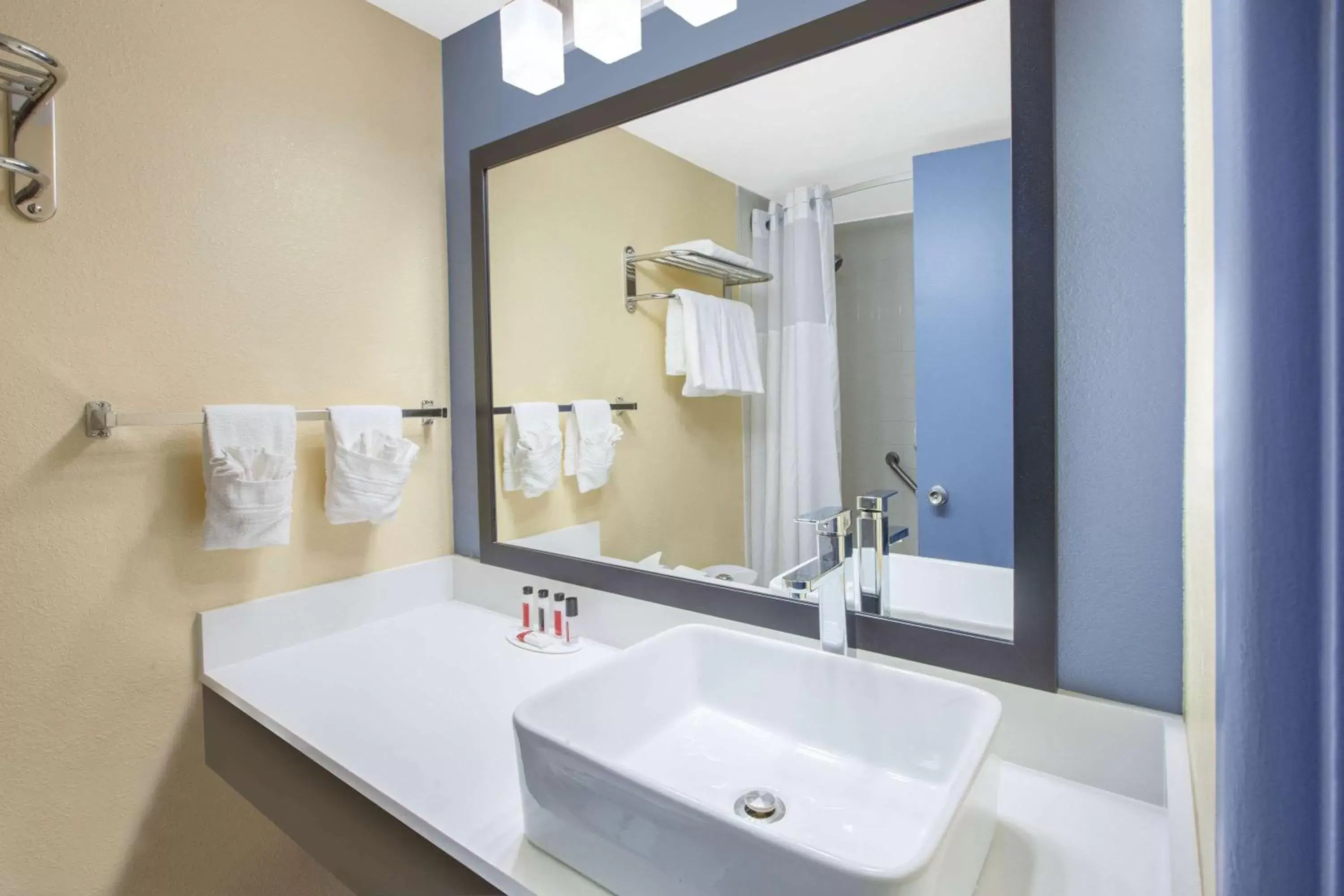 Bathroom in Days Inn & Suites by Wyndham Grand Rapids Near Downtown