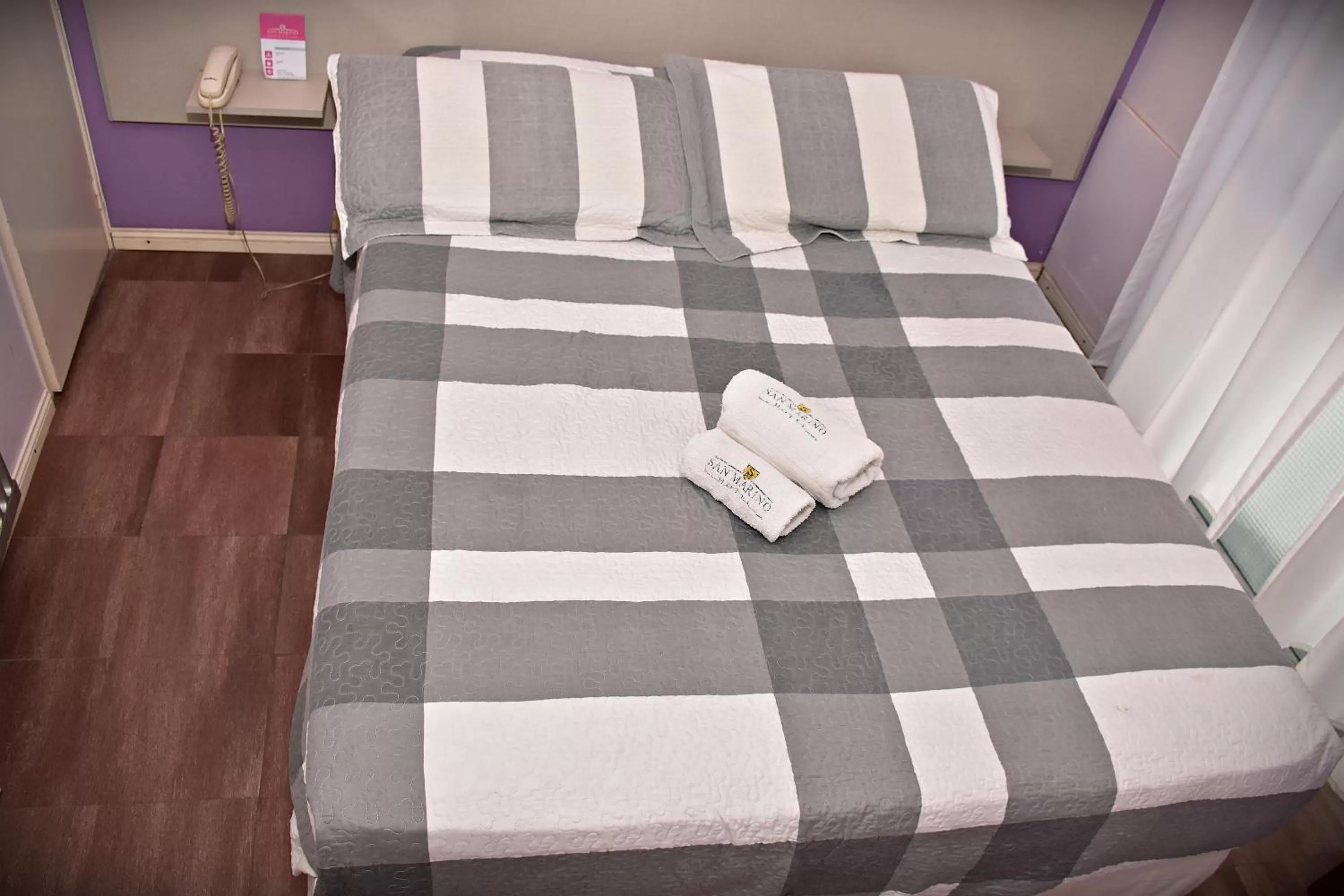 Bed in Hotel San Marino