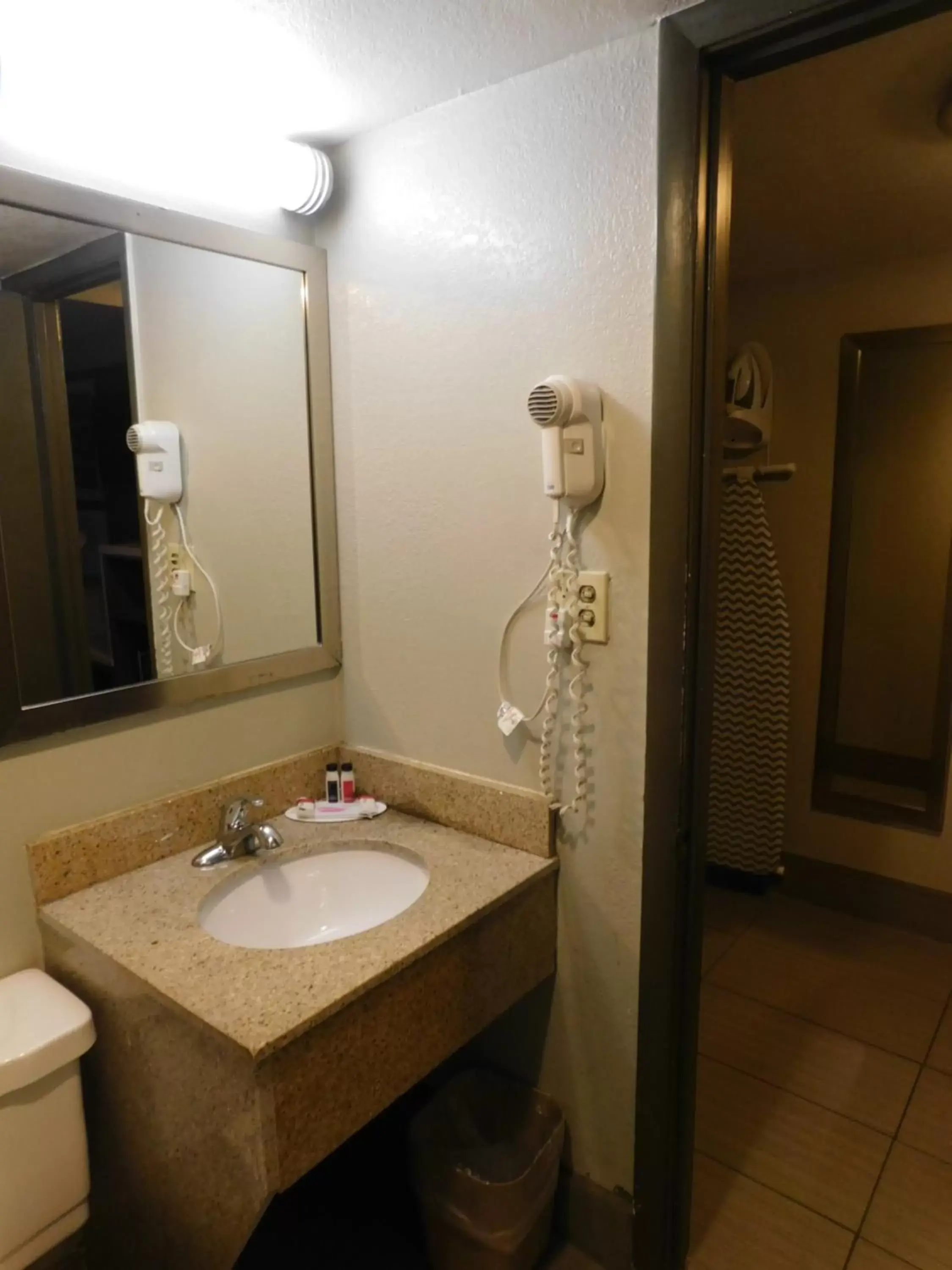 Bathroom in Days Inn & Suites by Wyndham Downtown Gatlinburg Parkway