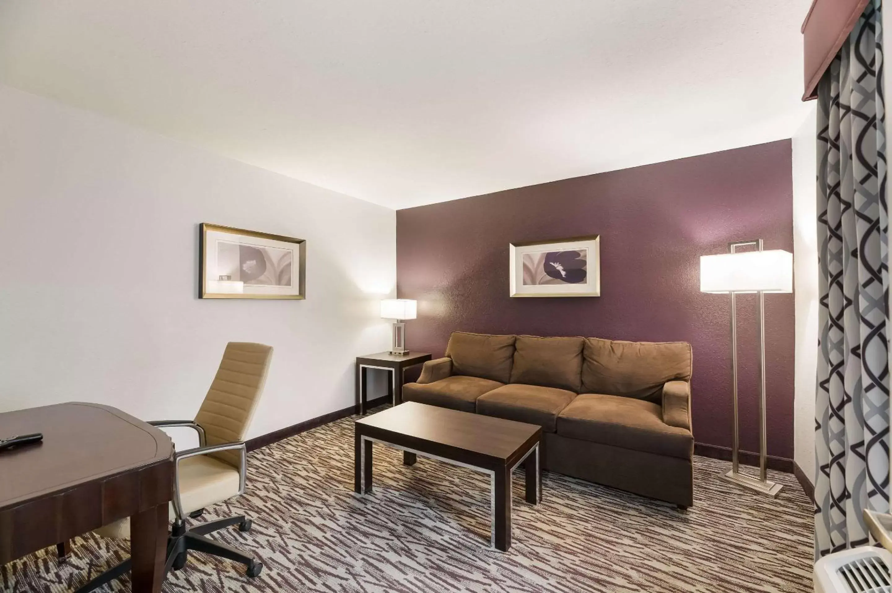 Bedroom, Seating Area in Clarion Inn & Suites Across From Universal Orlando Resort