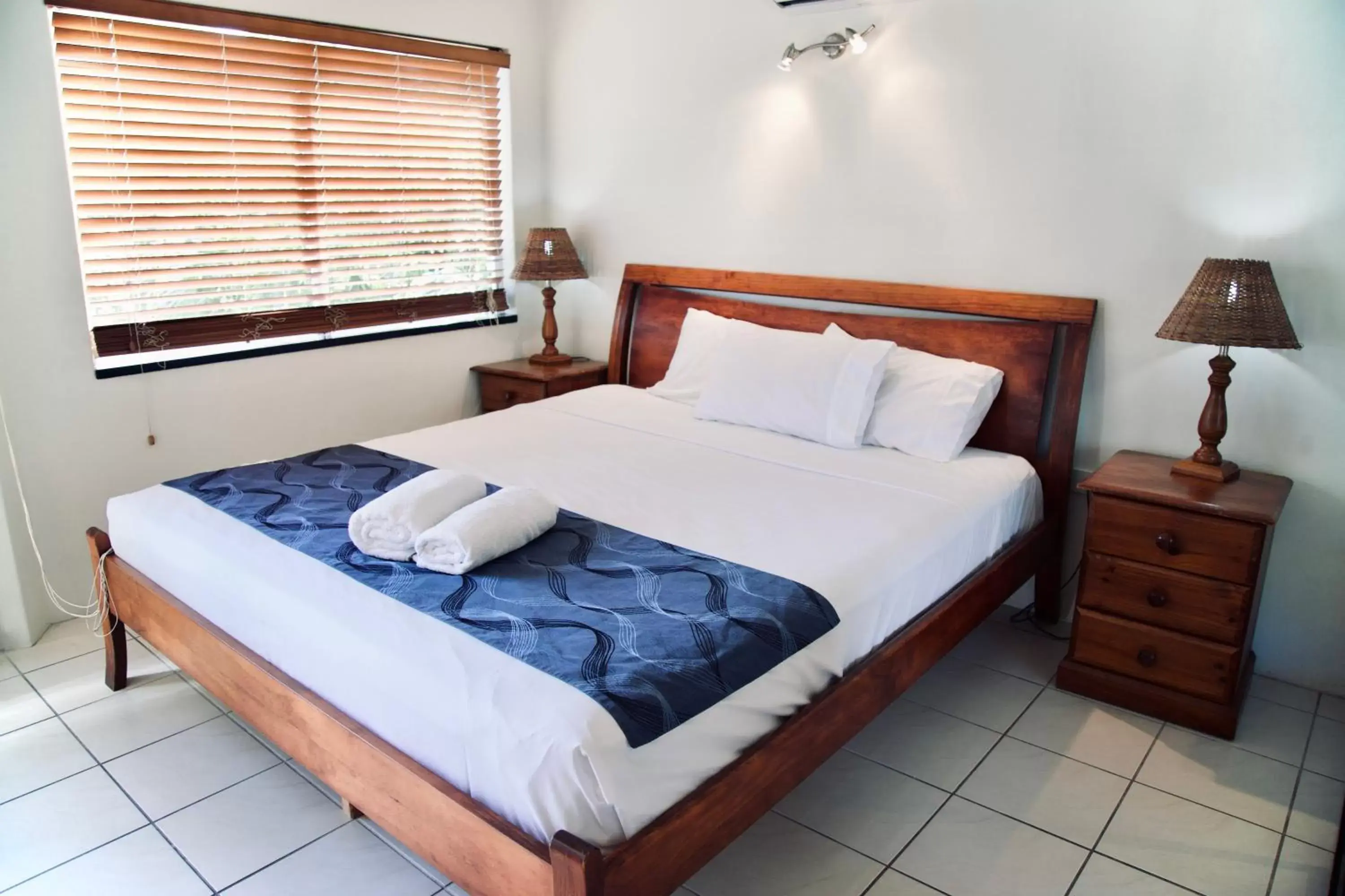 Bed in Reef Gateway Apartments