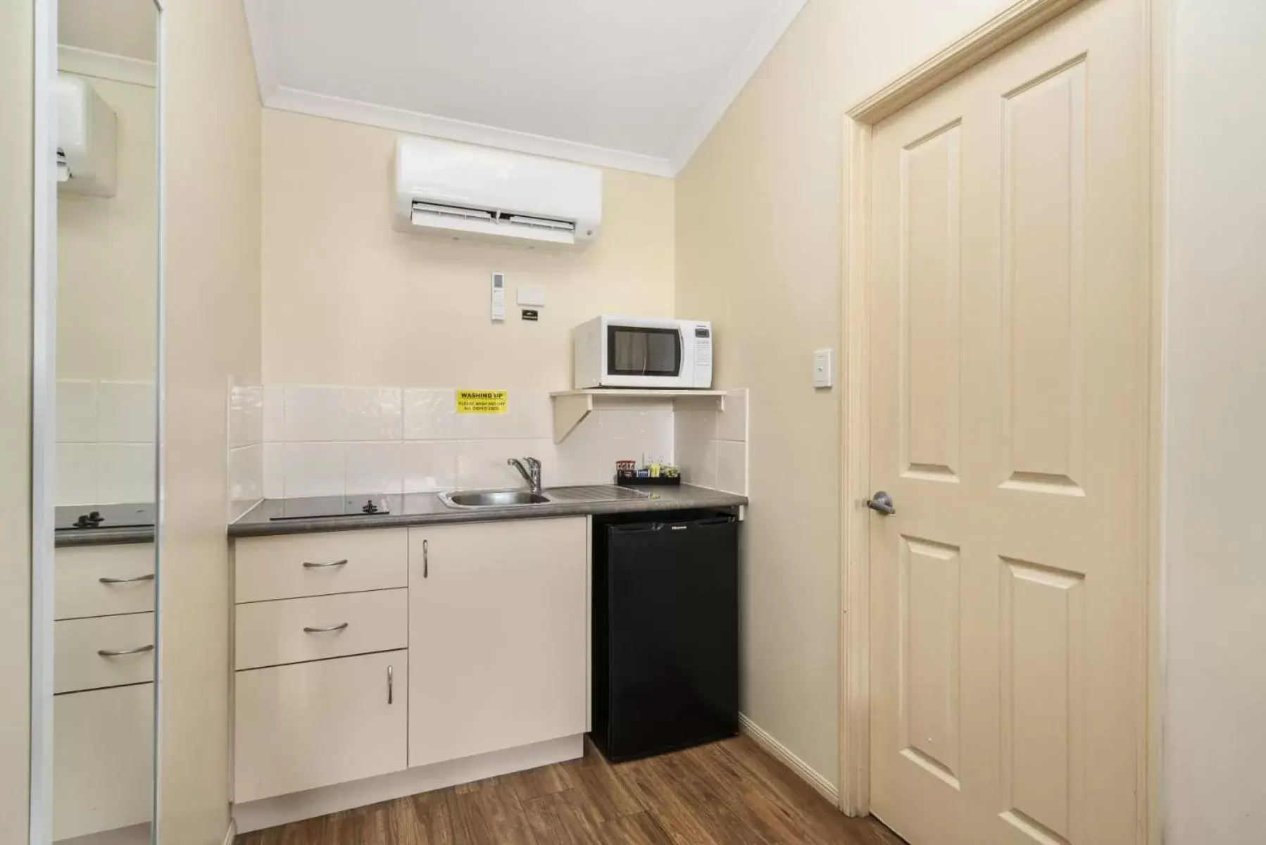 Kitchen or kitchenette, Kitchen/Kitchenette in Caboolture Central Motor Inn, Sure Stay Collection by BW