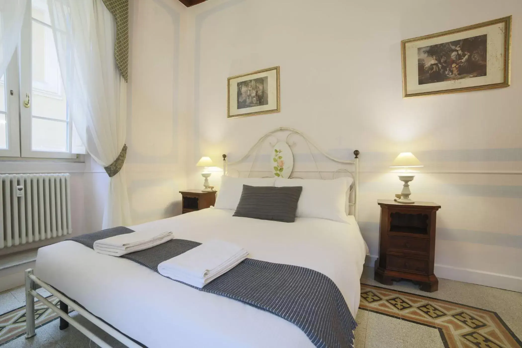Photo of the whole room, Bed in La Maison Dell'Orologio