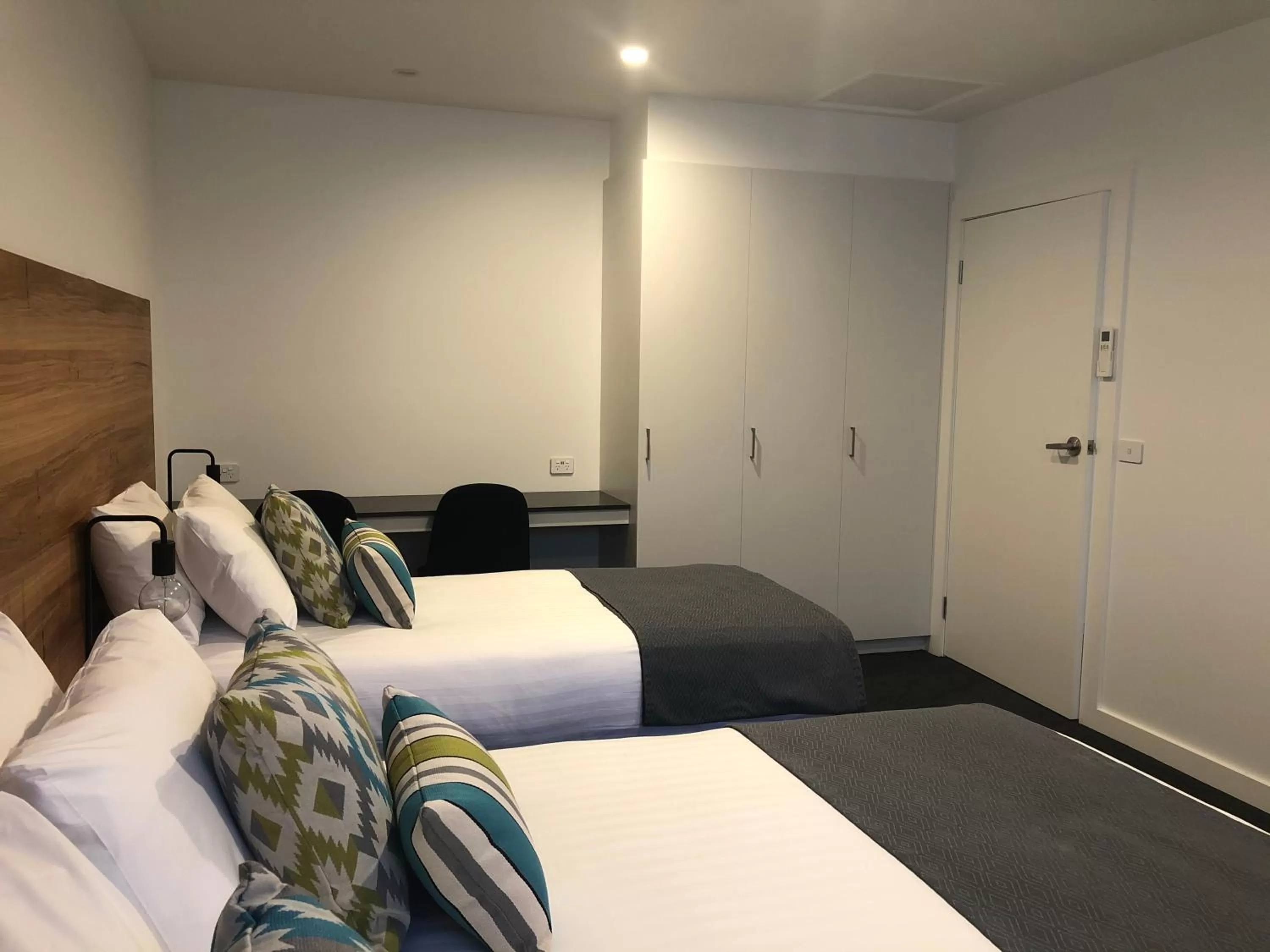 Bed in Bright Colonial Motel