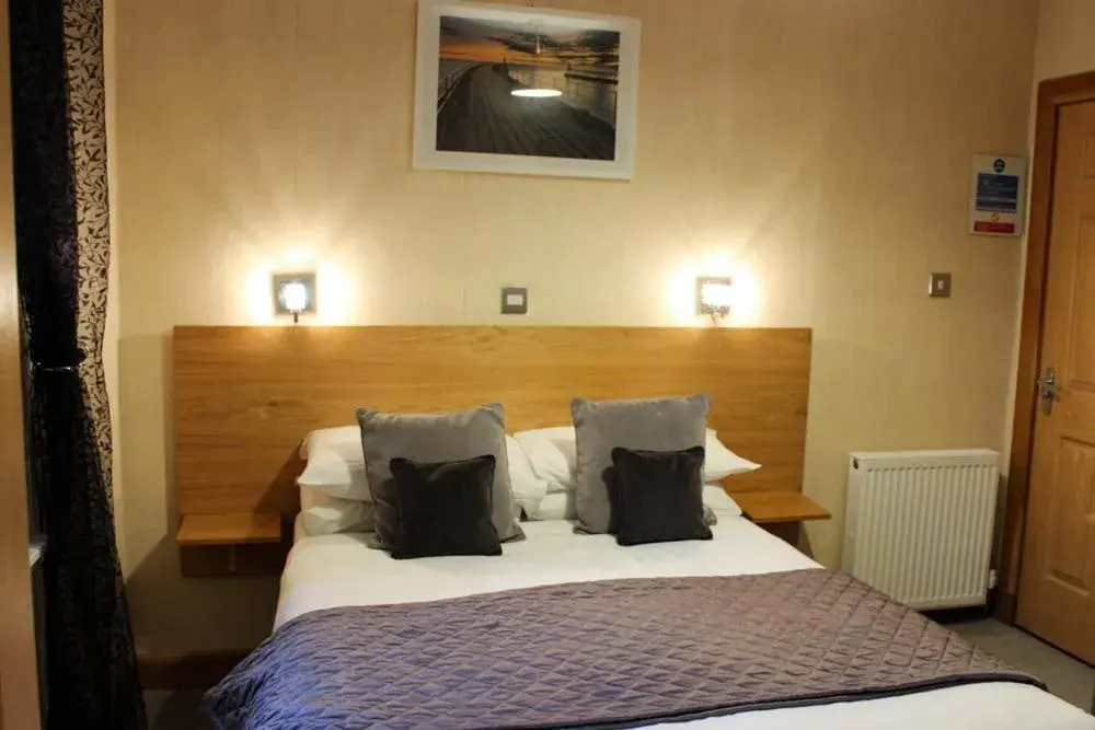 Bed in Station Hotel And Restaurant