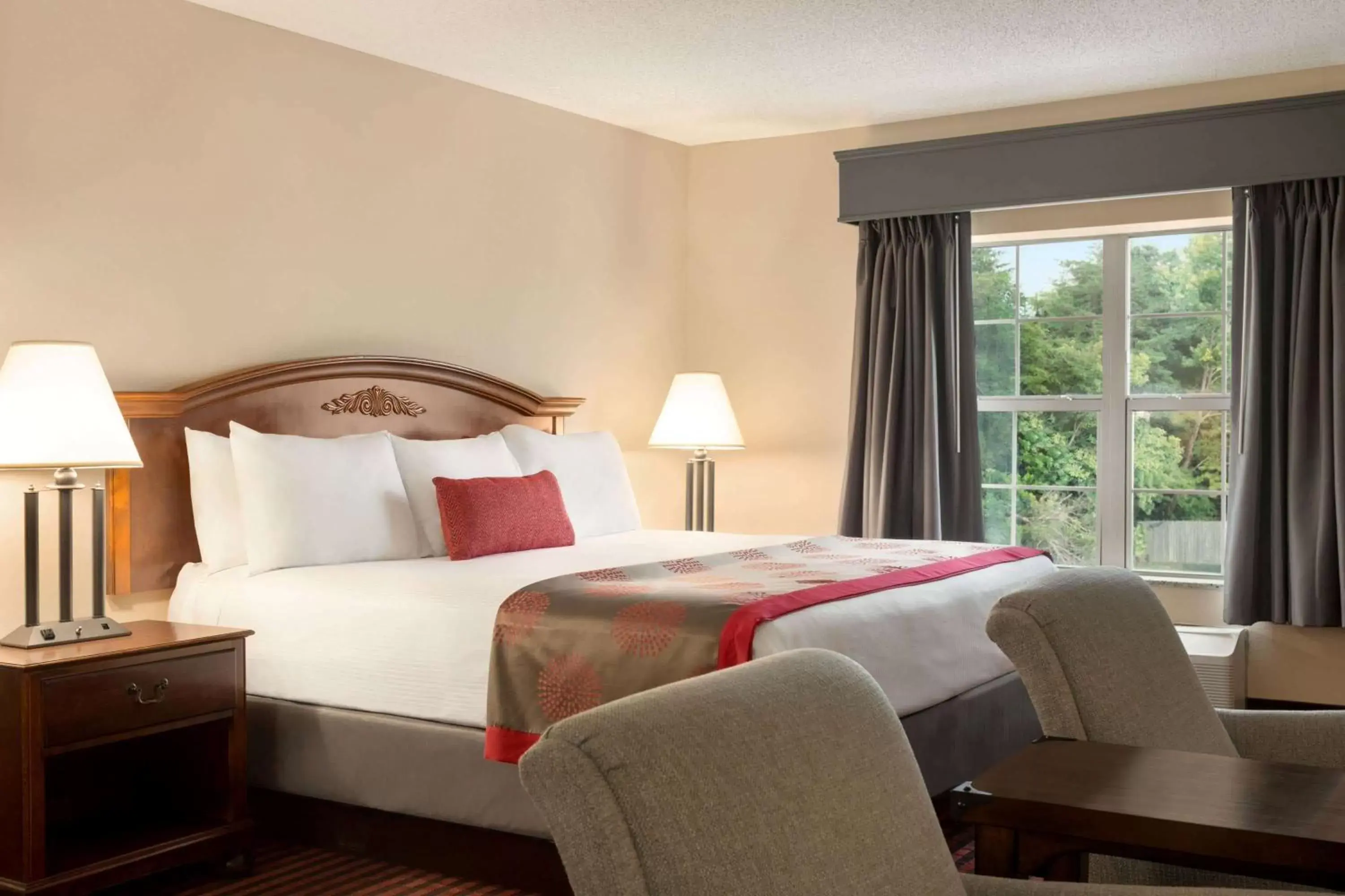 Photo of the whole room, Bed in Ramada by Wyndham Pigeon Forge North