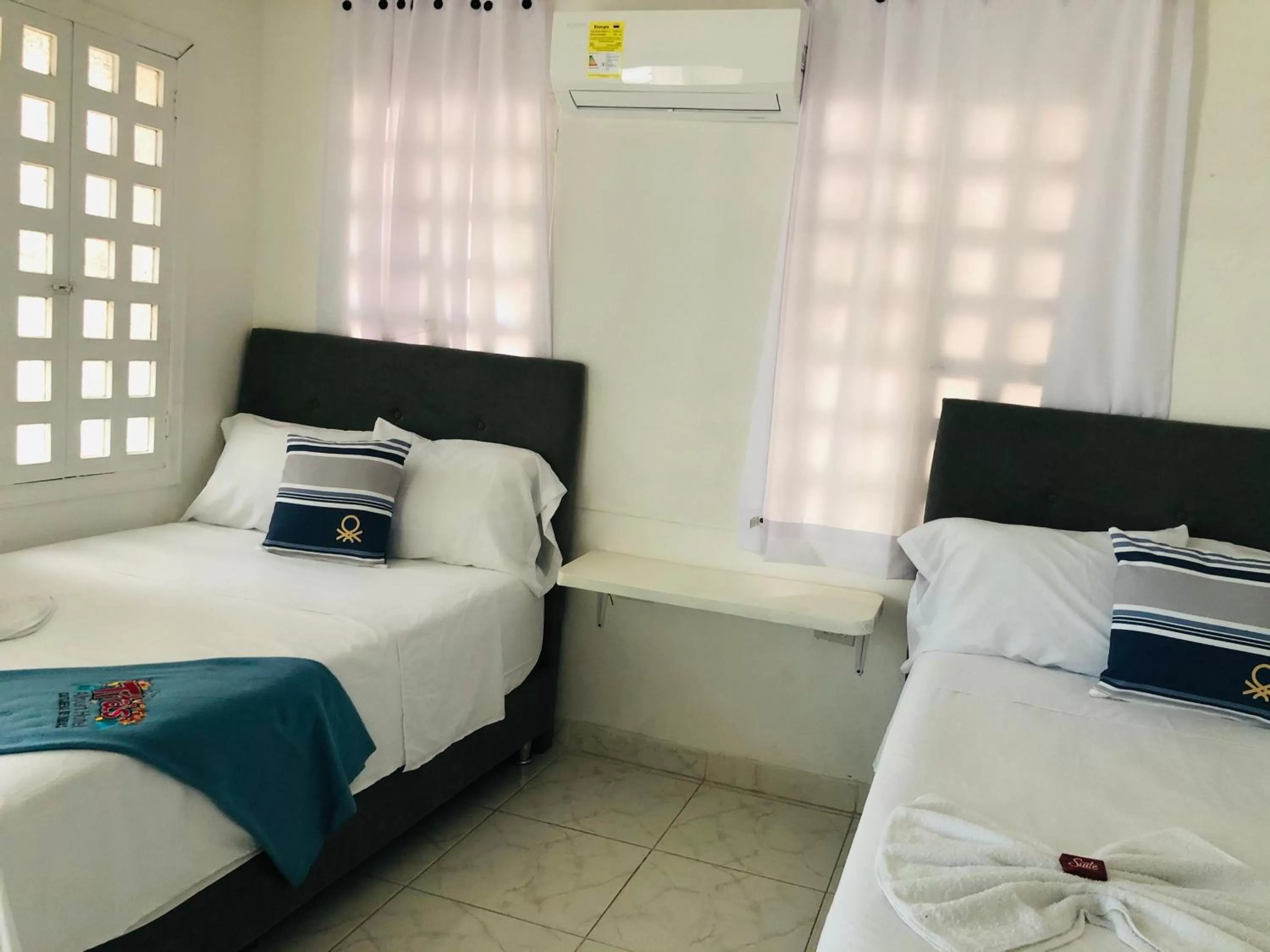 Bed in Tita’s Airport Hotel