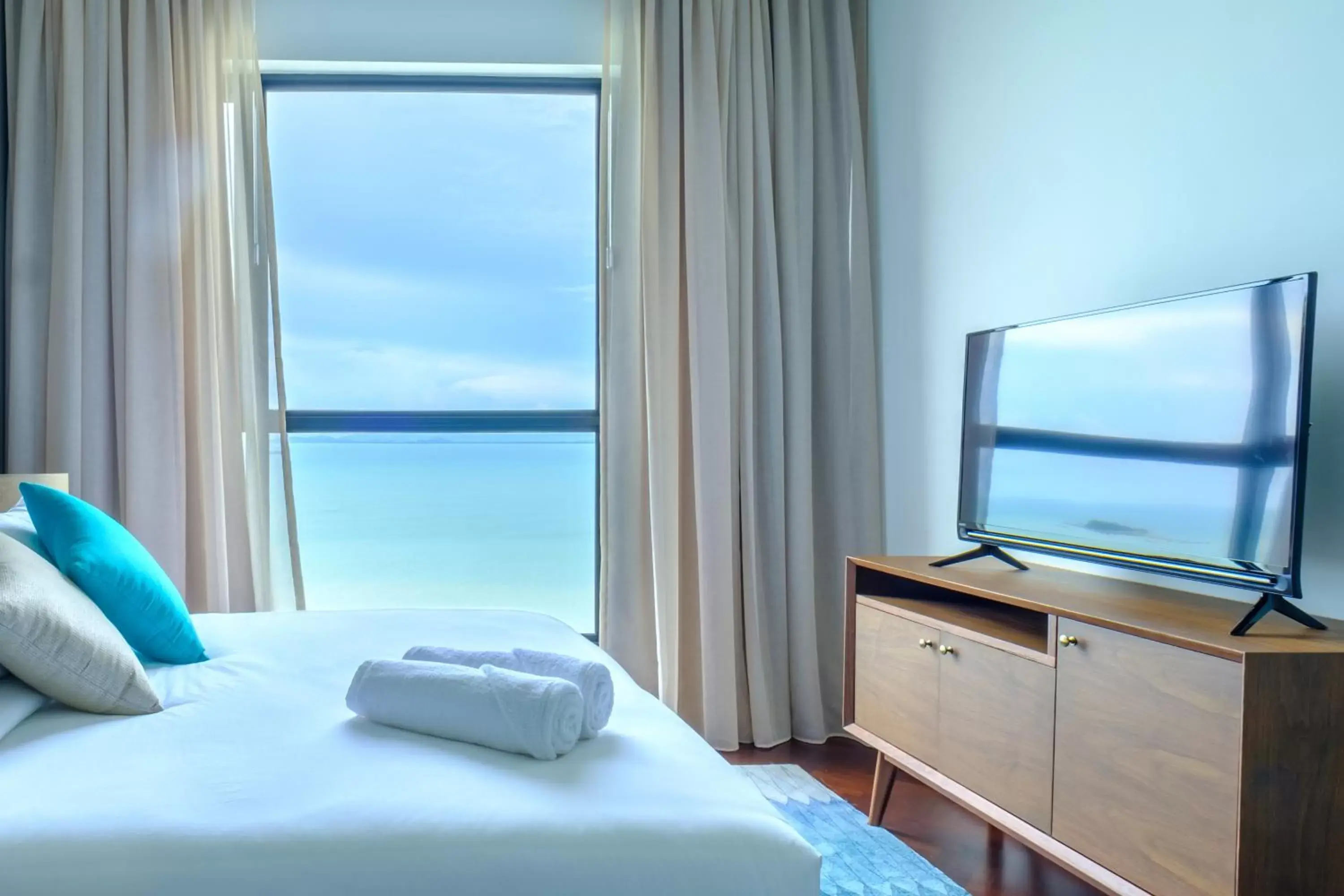Bed, Sea View in Tanjung Point Residences