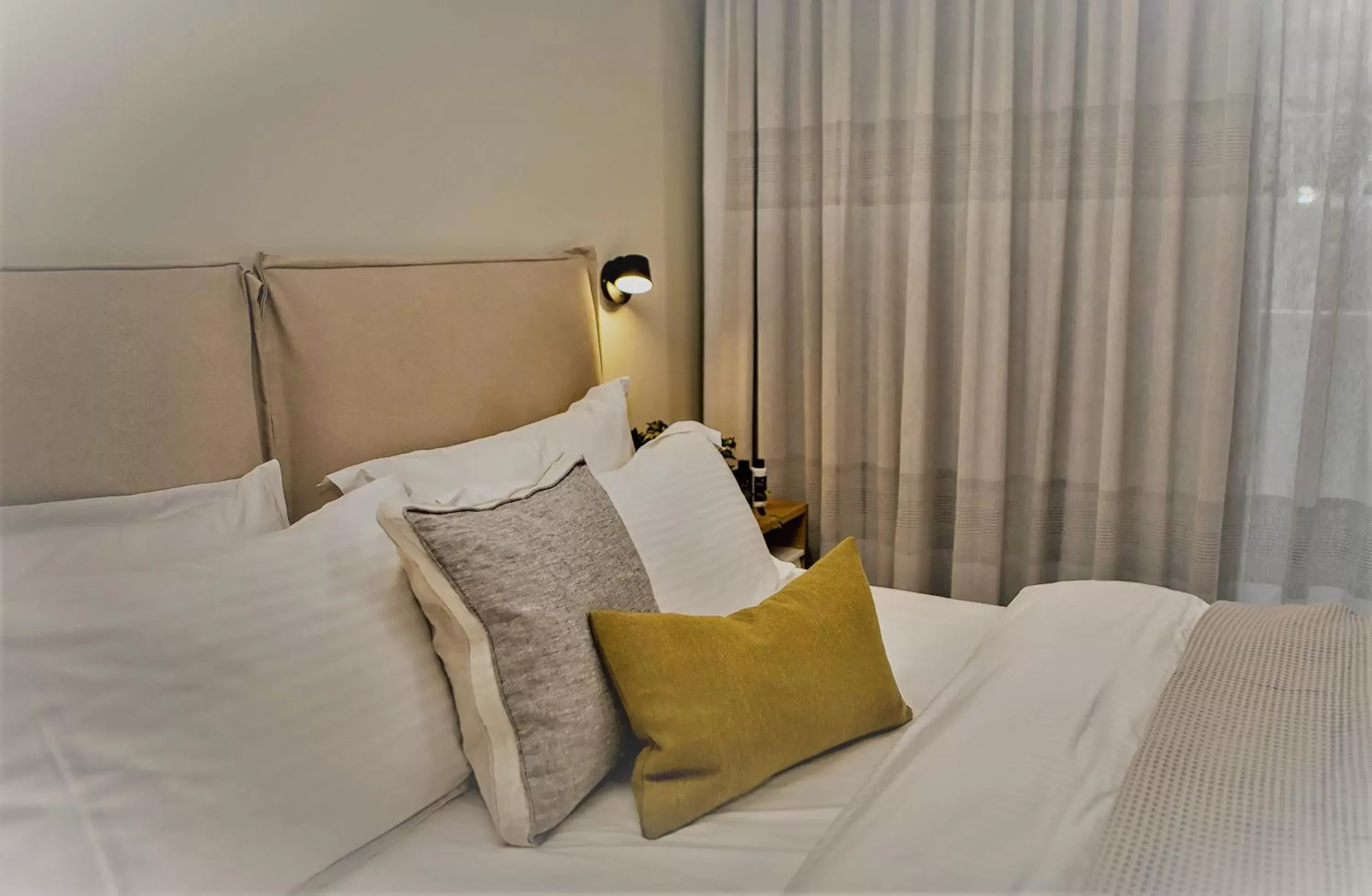 Bed in Mirivili Rooms & Suites