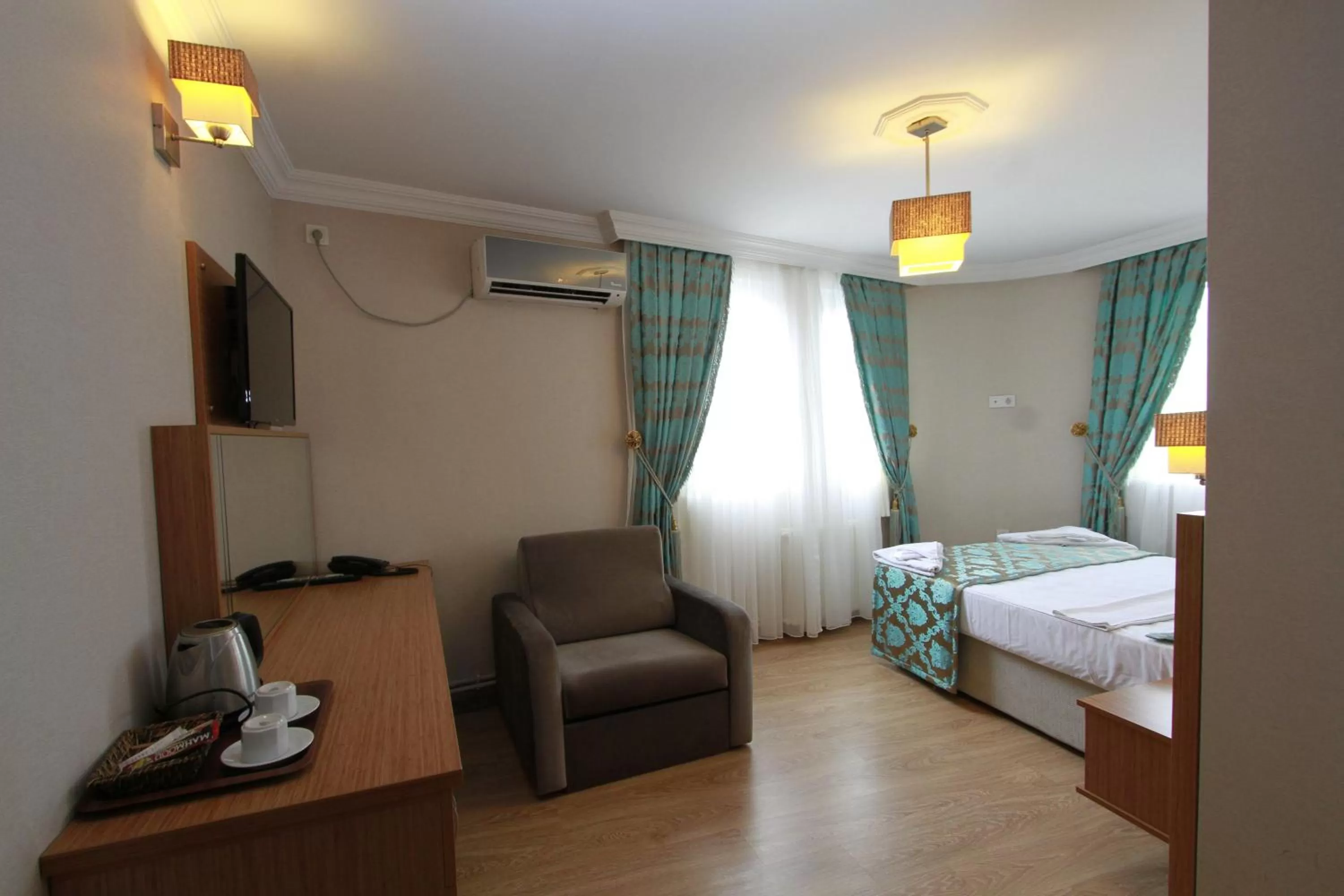 Bed in Agora Boutique Hotel & Bistro