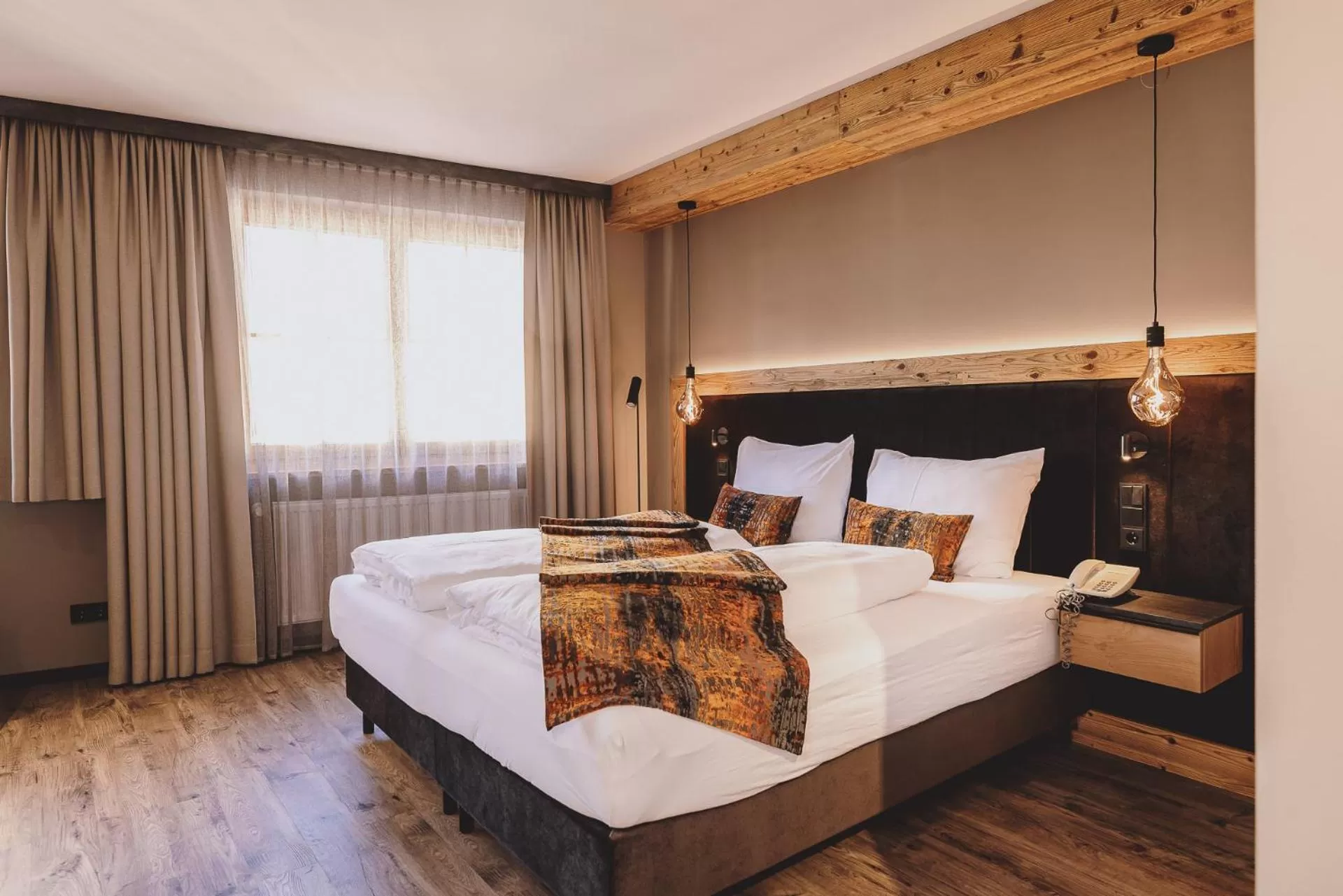 Bed in POST POST Hotel - Alpine Boutique Hotel & Spa