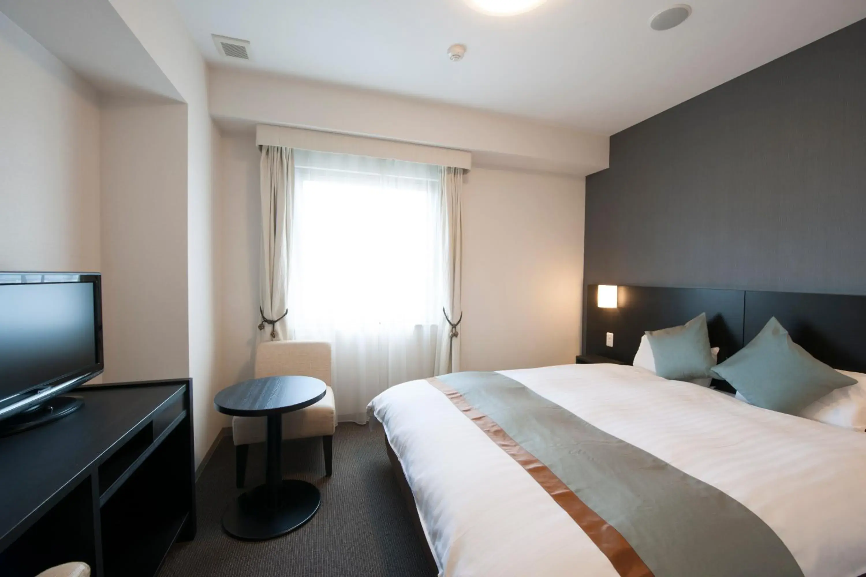 Bed in Dormy Inn Premium Shimonoseki