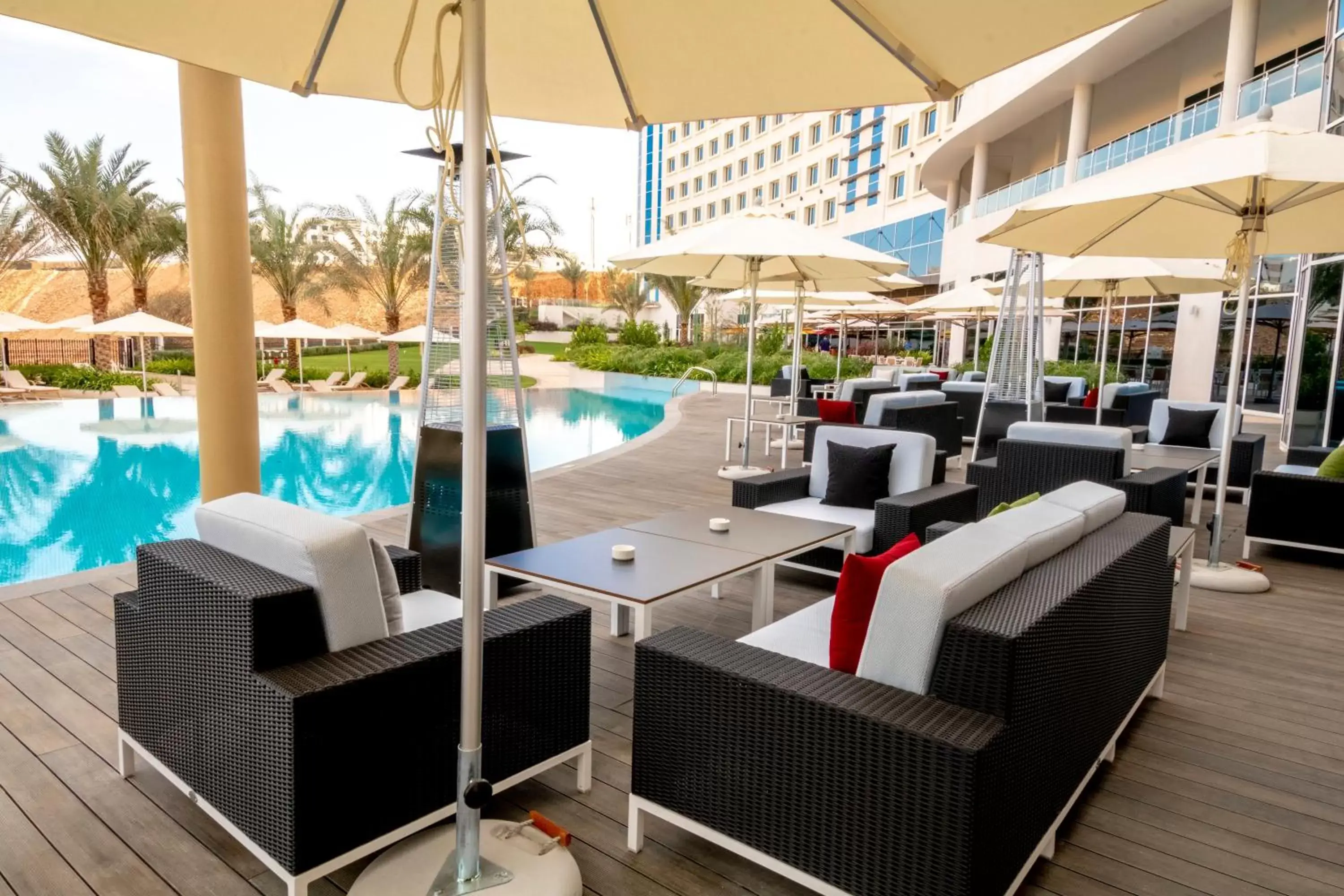 Lounge or bar, Swimming Pool in Crowne Plaza Muscat OCEC, an IHG Hotel