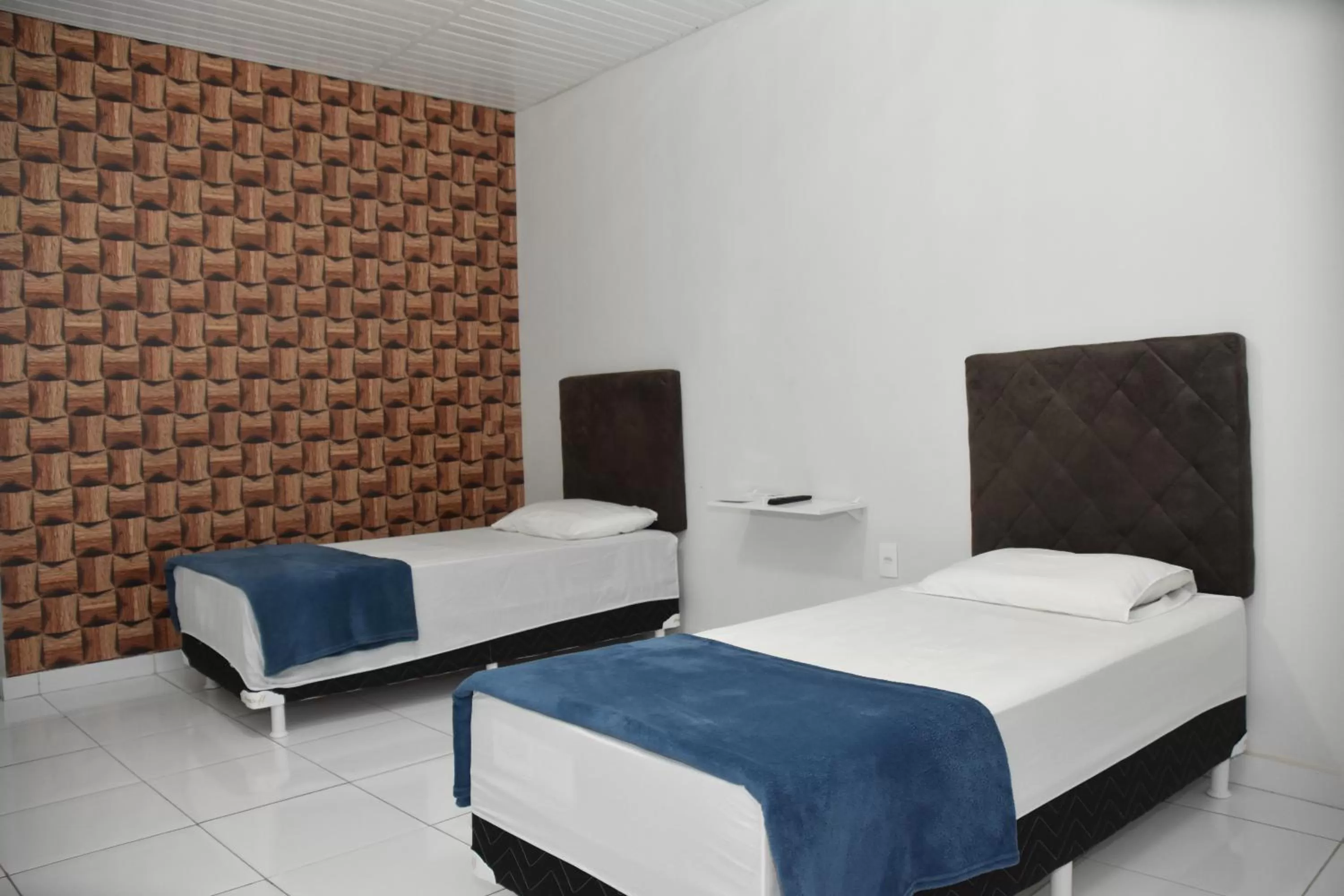 Bed in Pousada e Posto Amigão