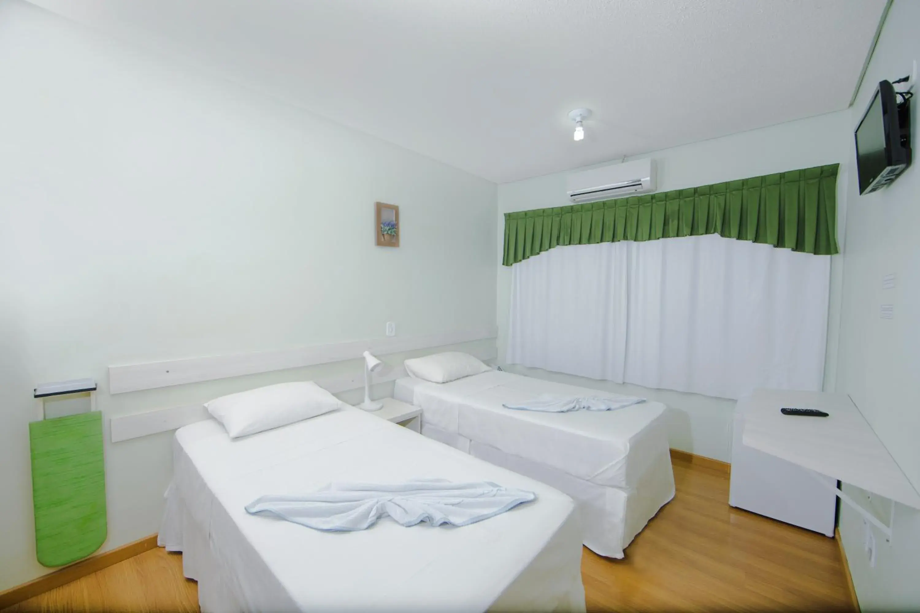 Bed in Pousada Charm Iguassu Suites