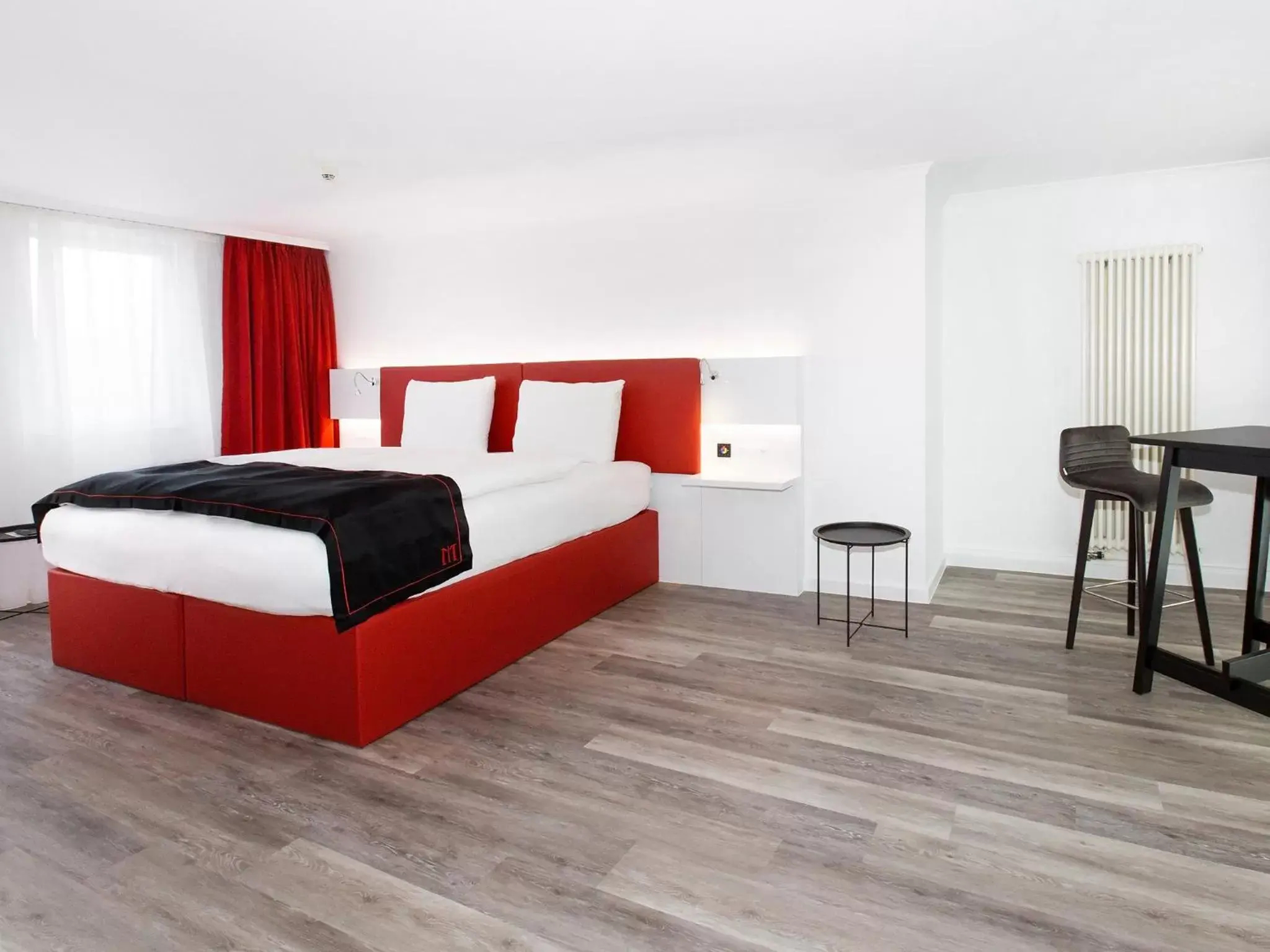 Photo of the whole room, Bed in DORMERO Hotel Zürich Airport