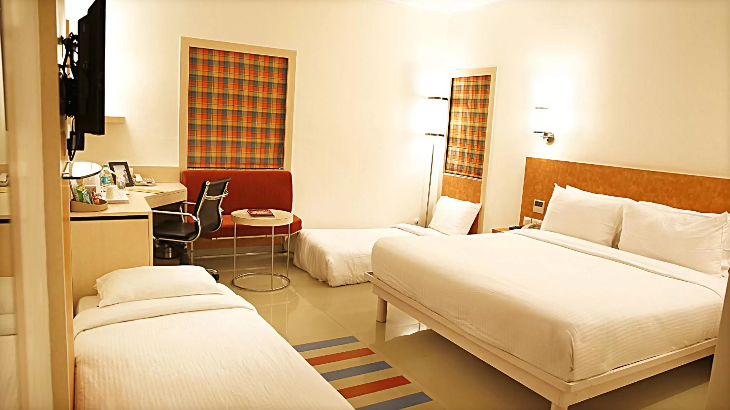 Bed in Nirwana Hometel Jaipur- A Sarovar Hotel