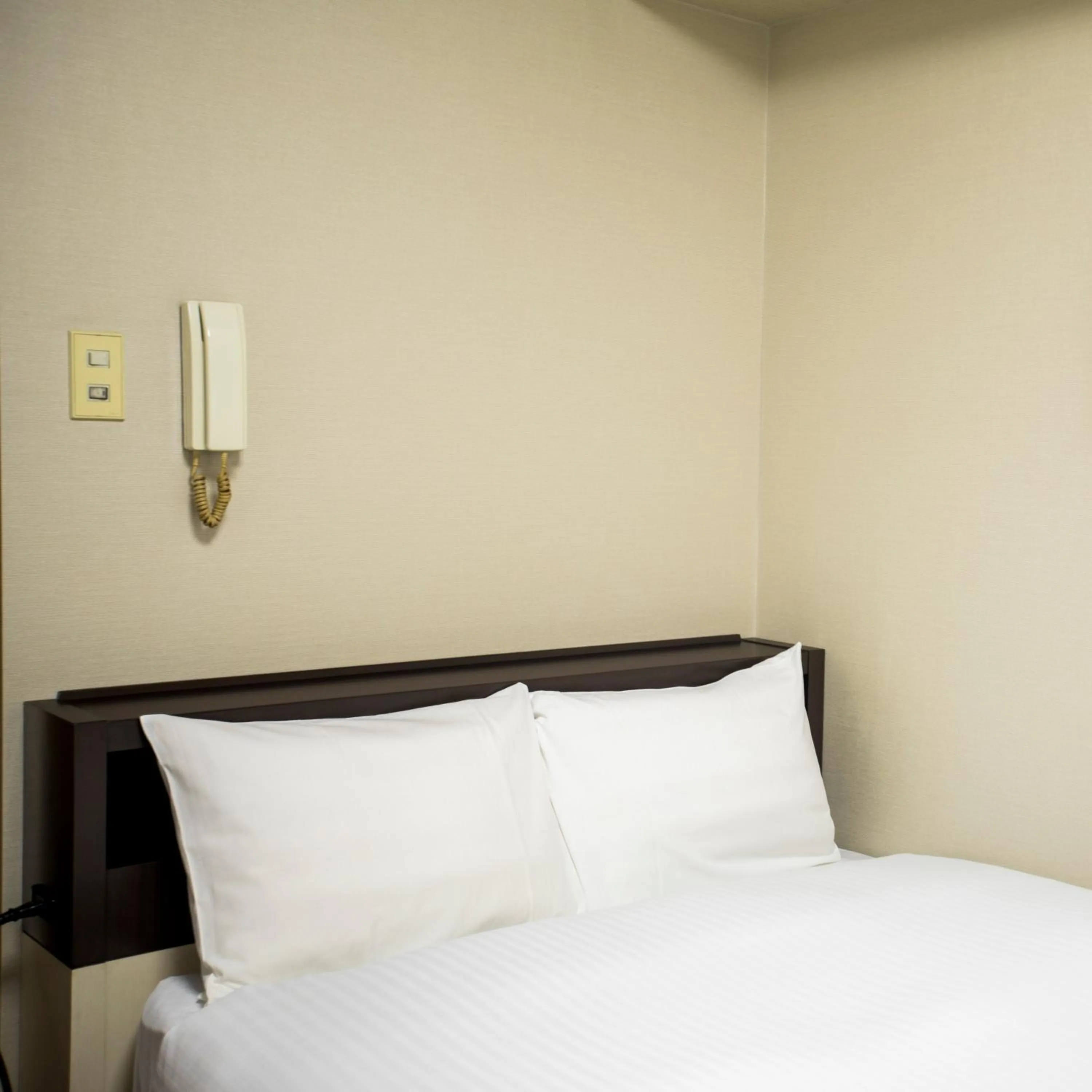 Bed in FLEXSTAY INN Kawasaki Kaizuka