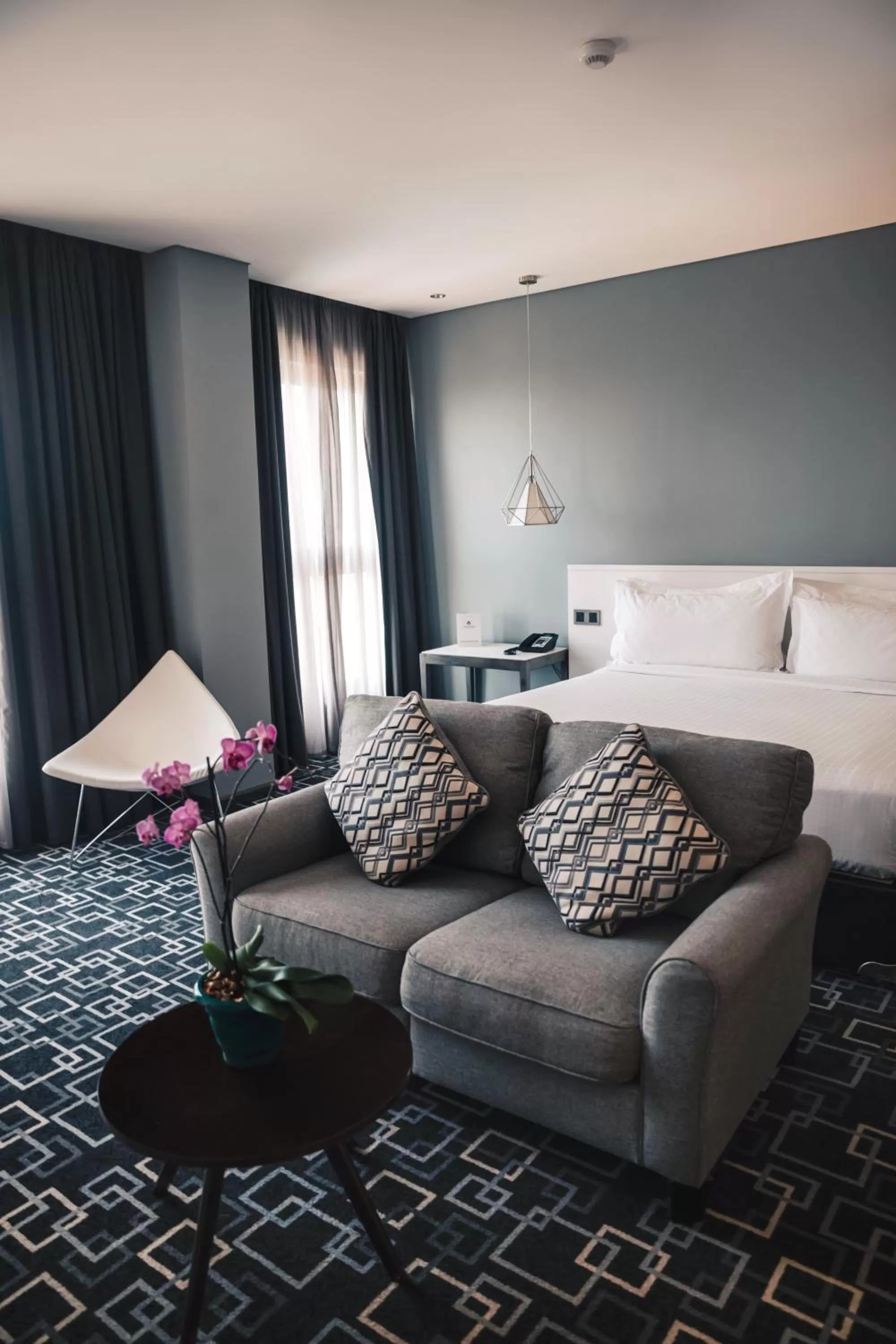 Seating area, Bed in Trademark Hotel, a Member of Design Hotels