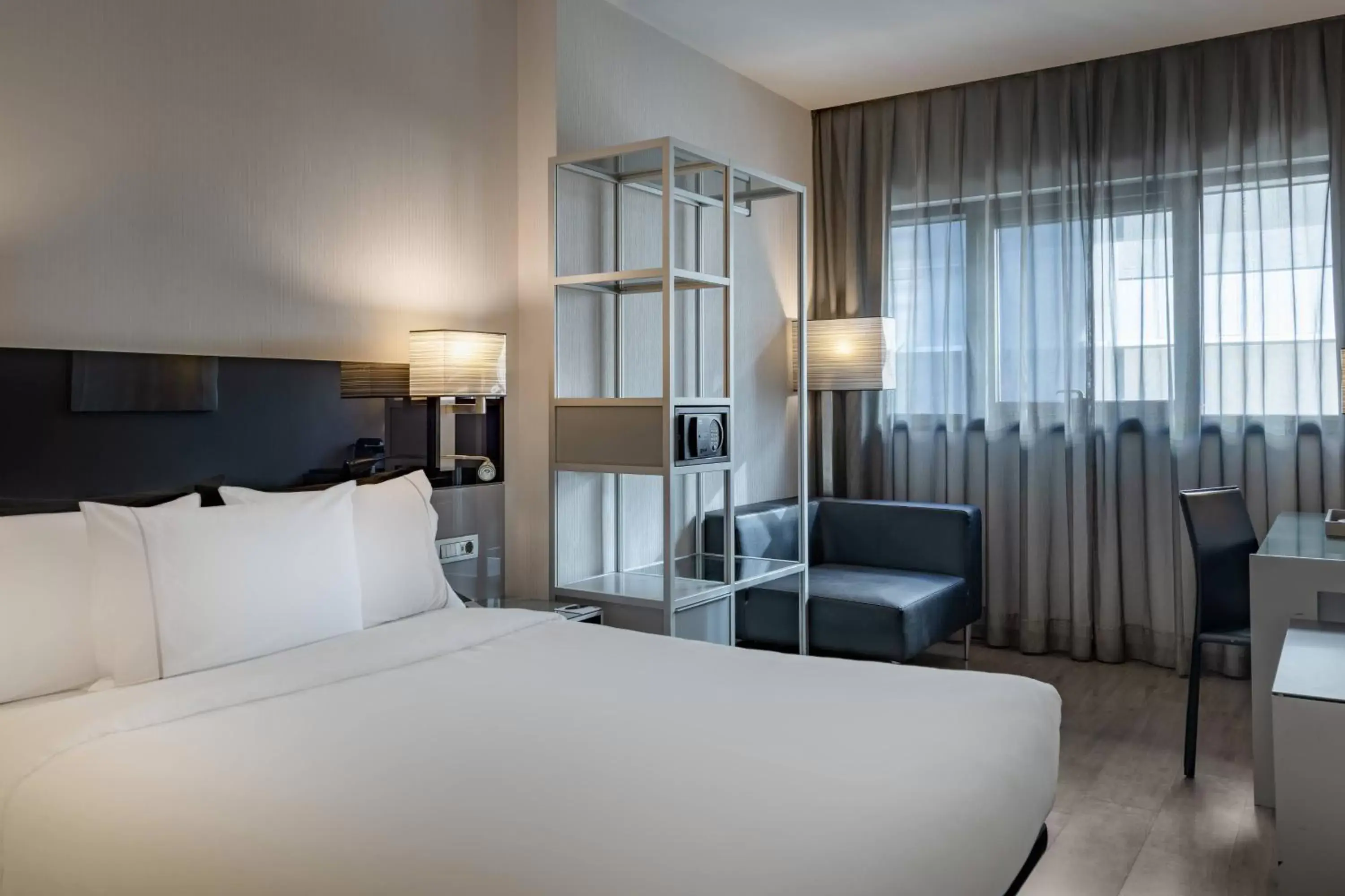 Photo of the whole room, Bed in AC Hotel Atocha by Marriott