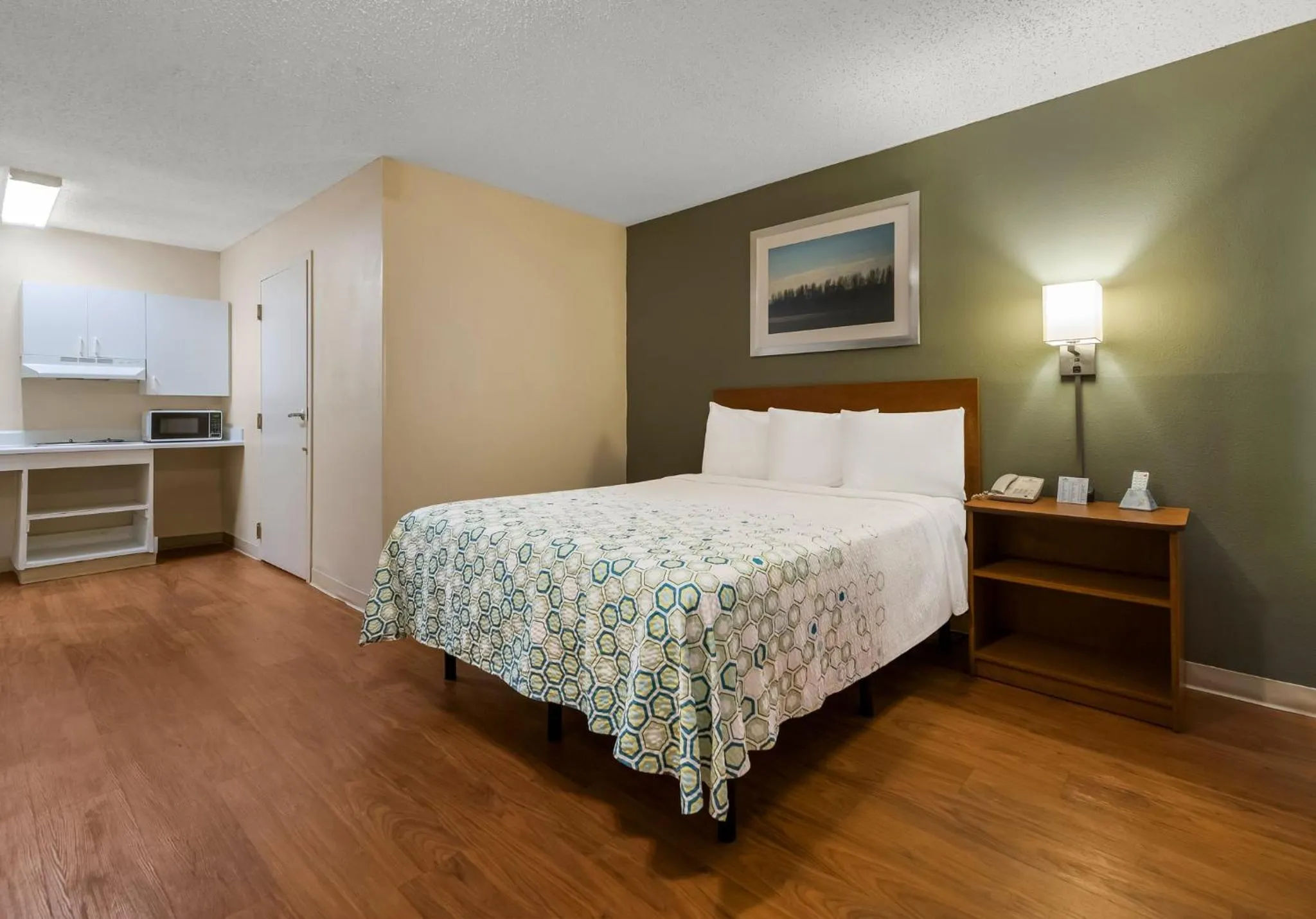 Bedroom, Bed in HomeTowne Studios by Red Roof Orlando - UCF Area