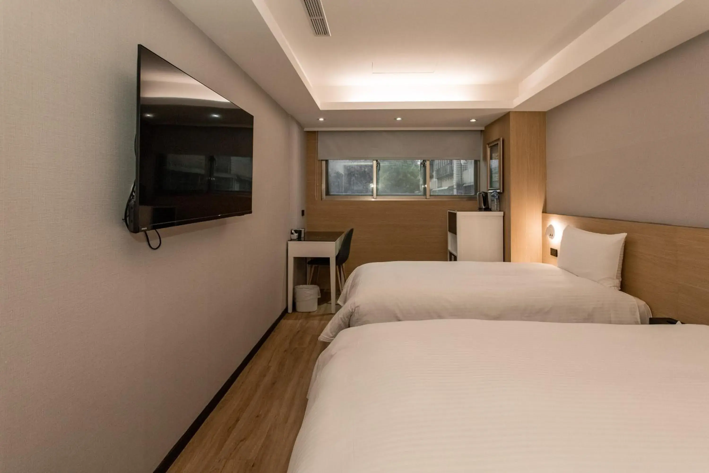 Bed in Hub Hotel Tucheng