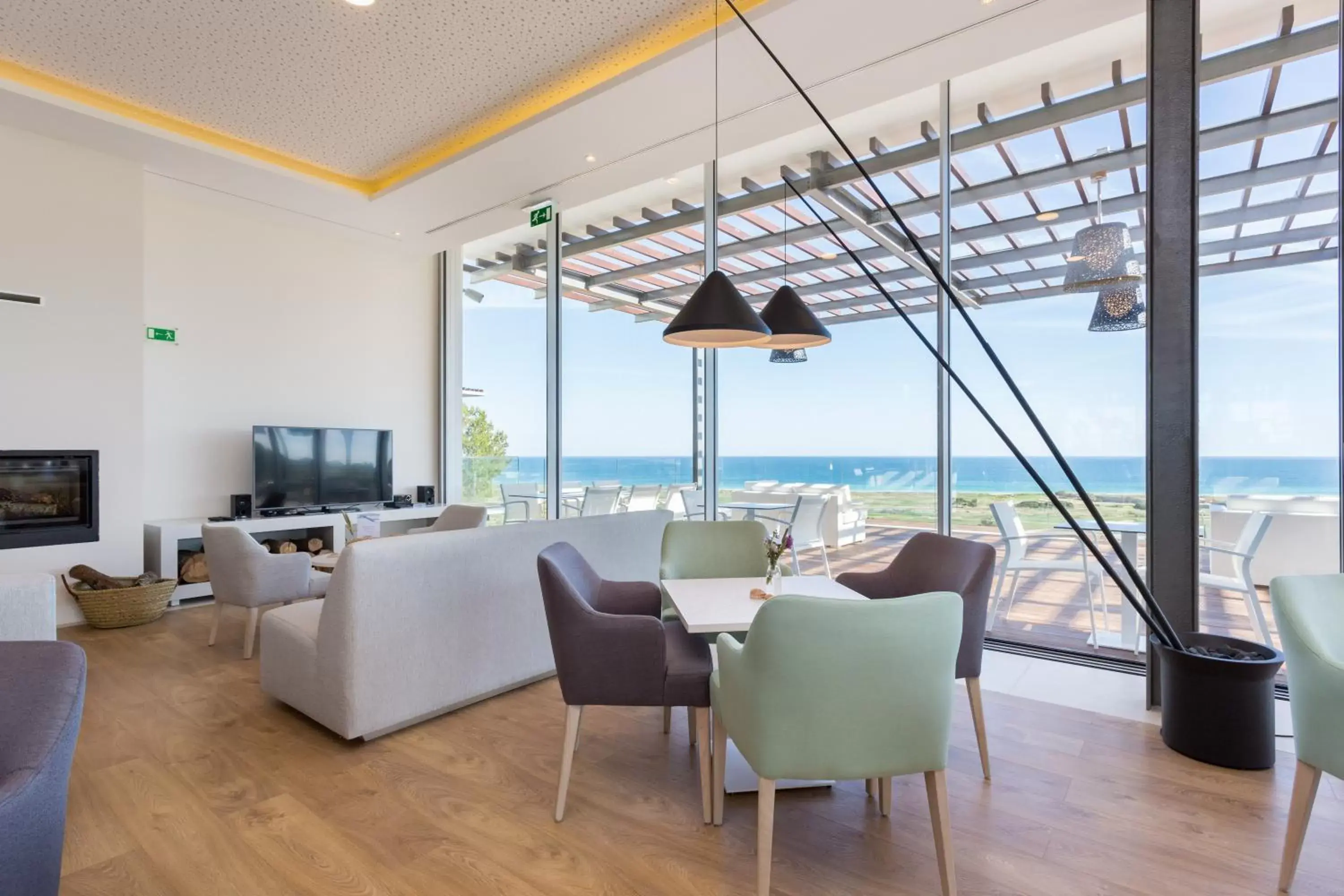 Communal lounge/ TV room in Palmares Beach House Hotel - Adults Only