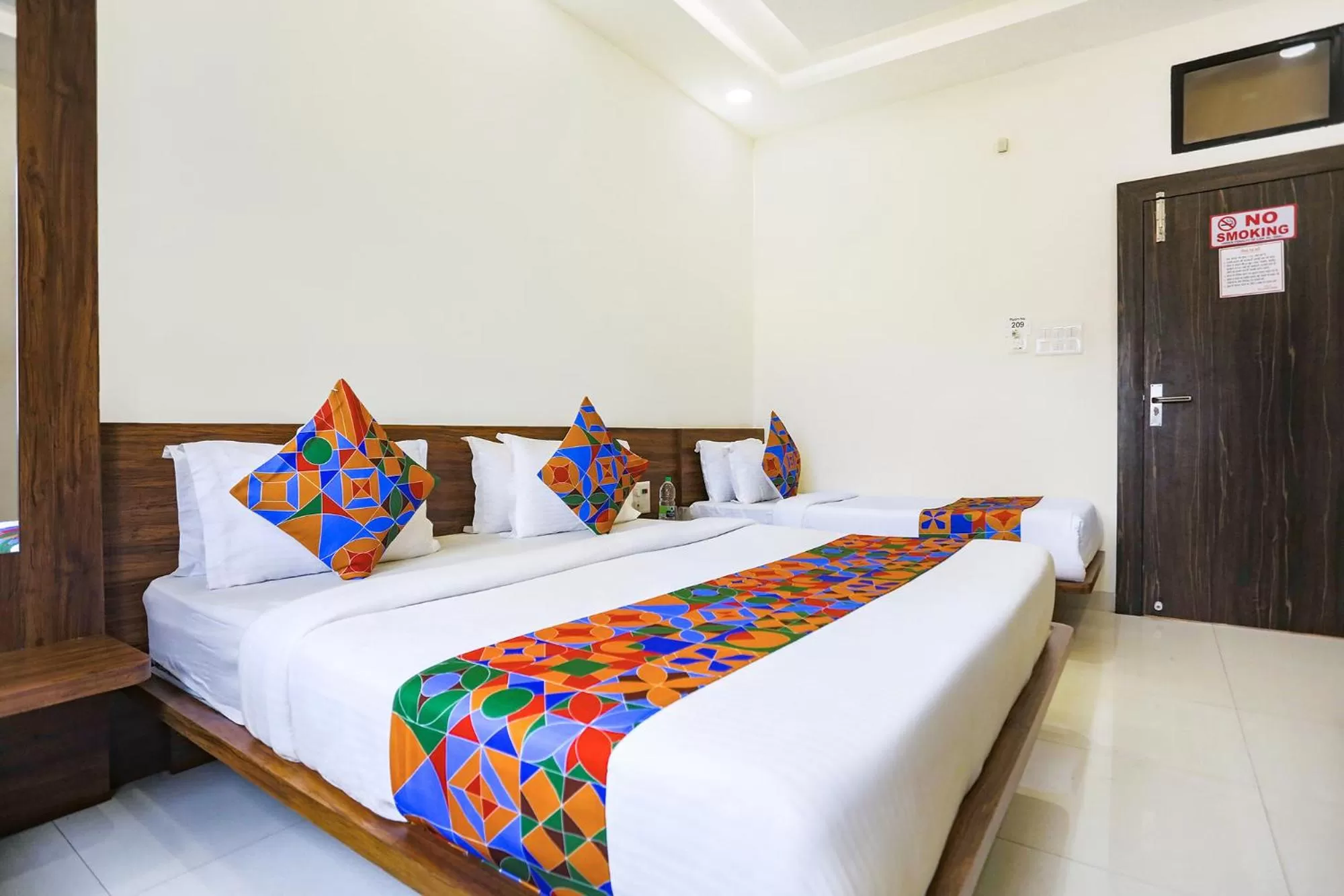 Bed in FabHotel Balaji Paradise