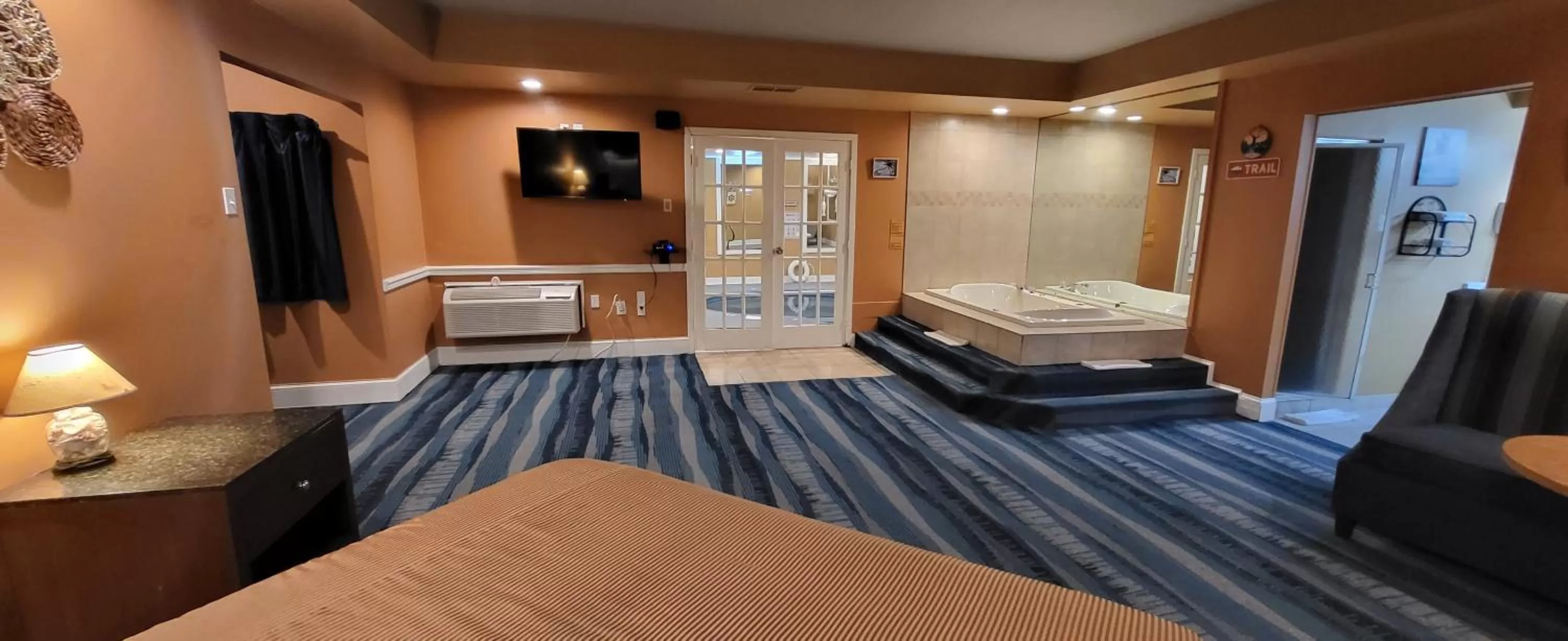 Communal lounge/ TV room, Bed in Inn of the Dove - Romantic Luxury Suites with Jacuzzi & Seasonal Fireplace at Harrisburg-Hershey-Philadelphia, PA