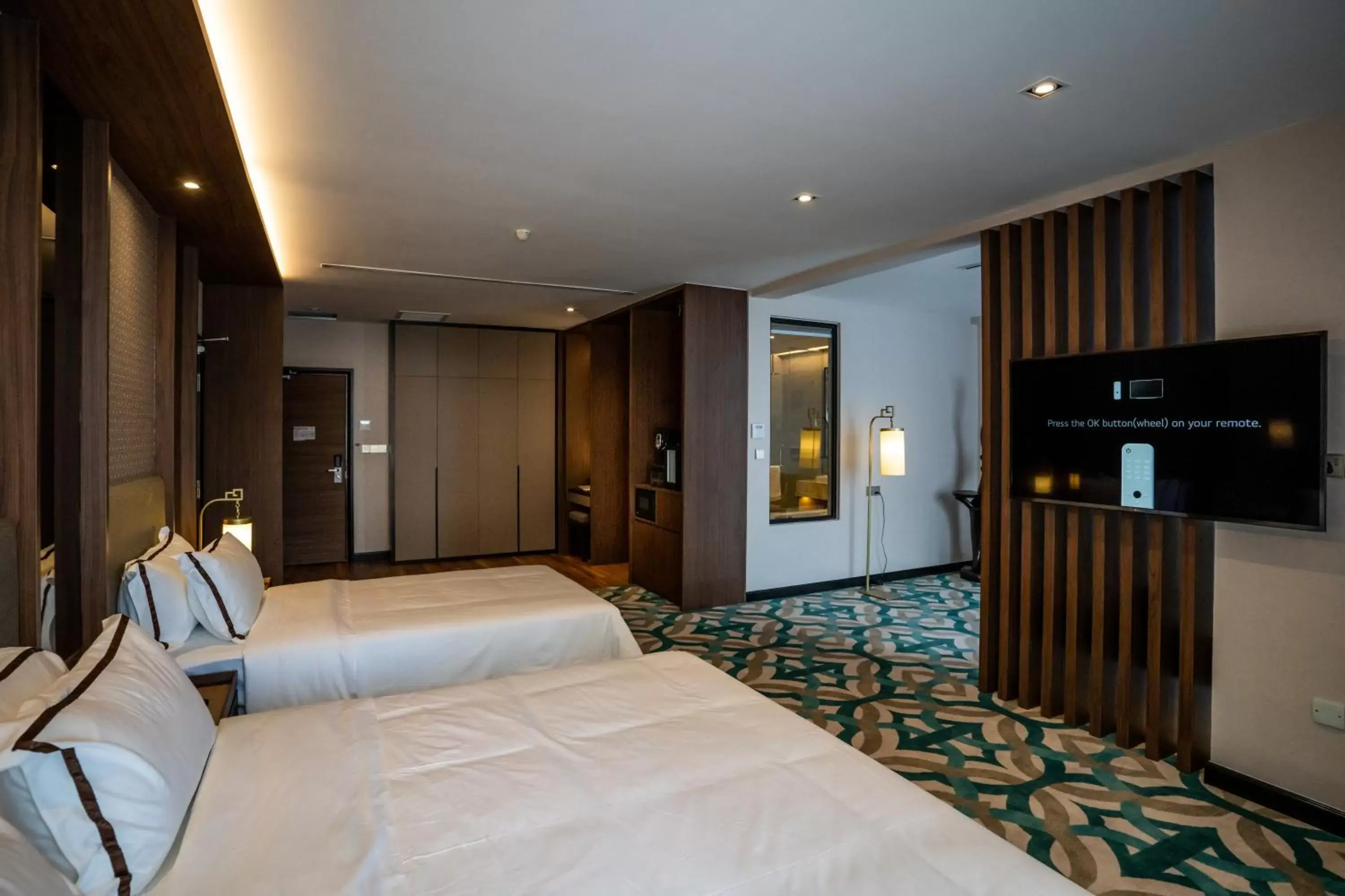 Bed in CHRISTEE SUITES HOTEL Bed in CHRISTEE SUITES HOTEL