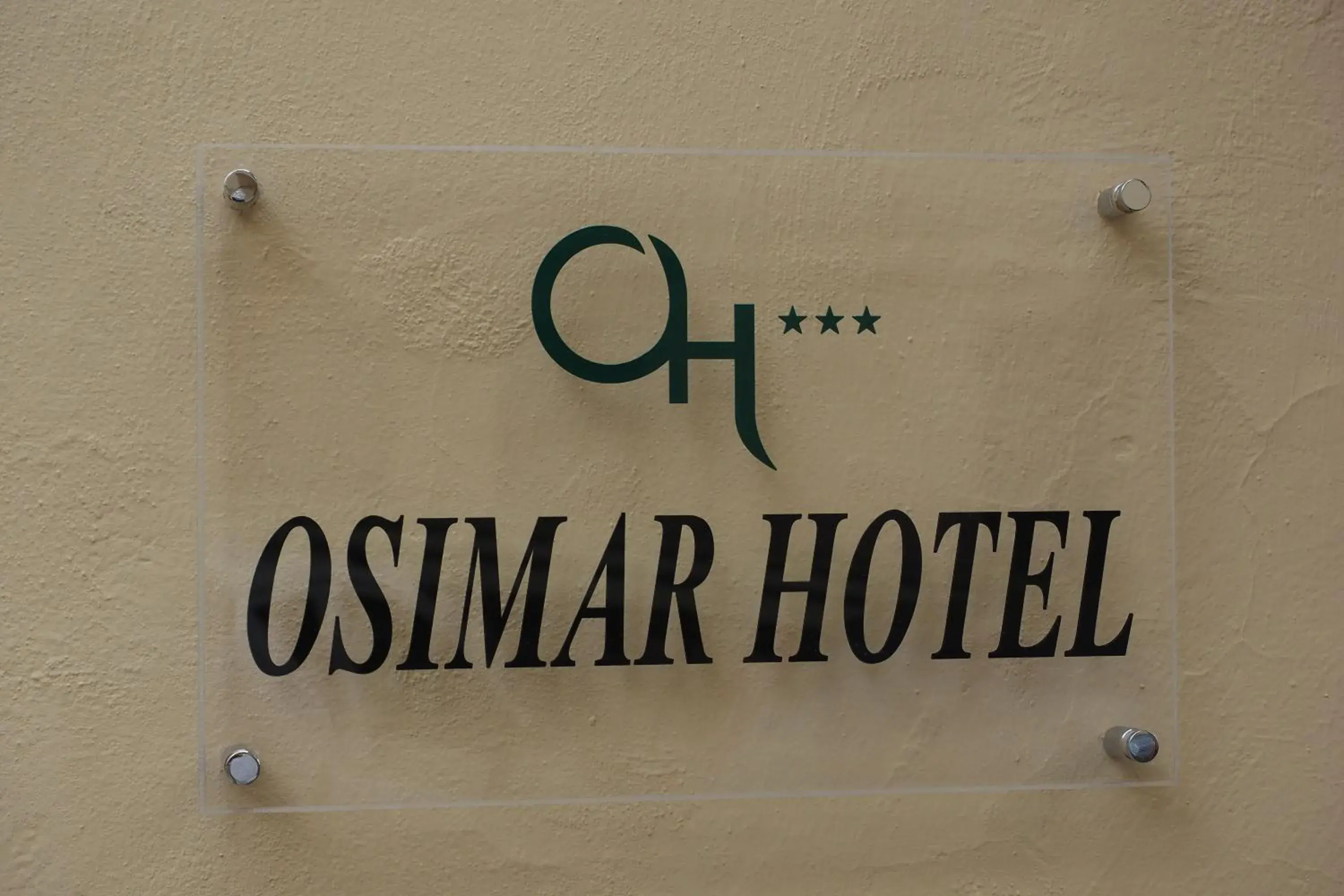 Property logo or sign in Hotel Osimar