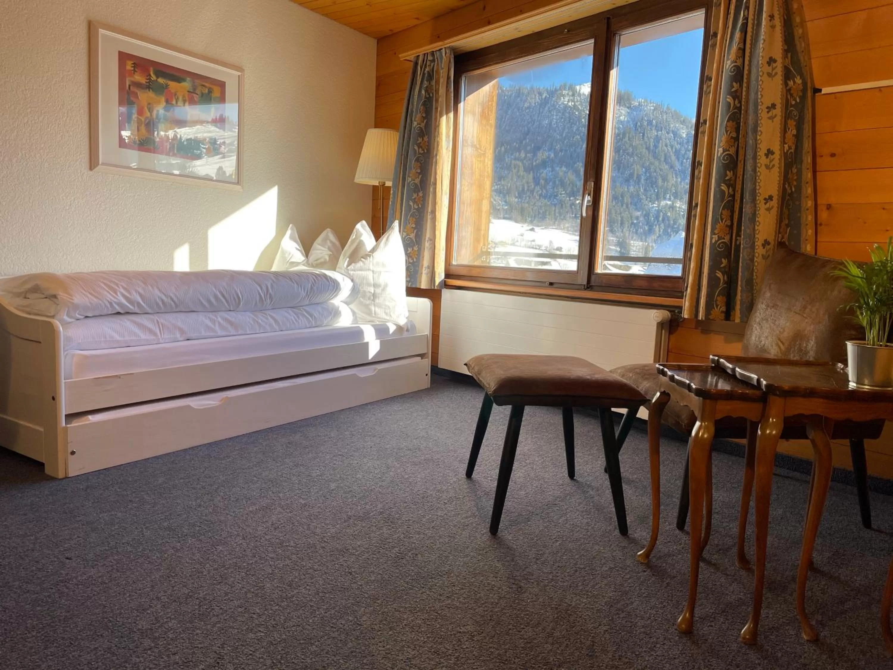 Living room, Bed in Dinh Residence