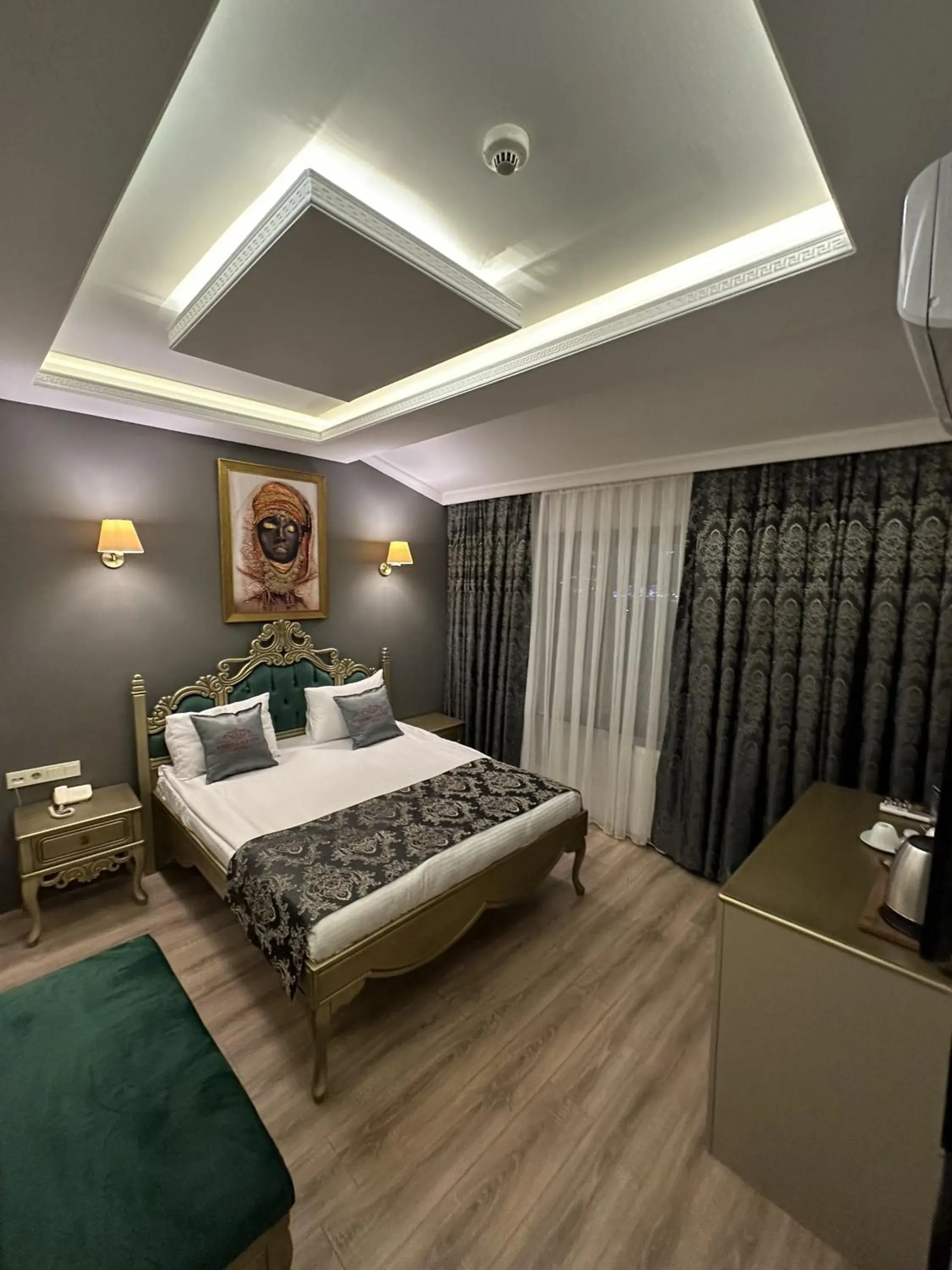 Bed in Ethnica Suites
