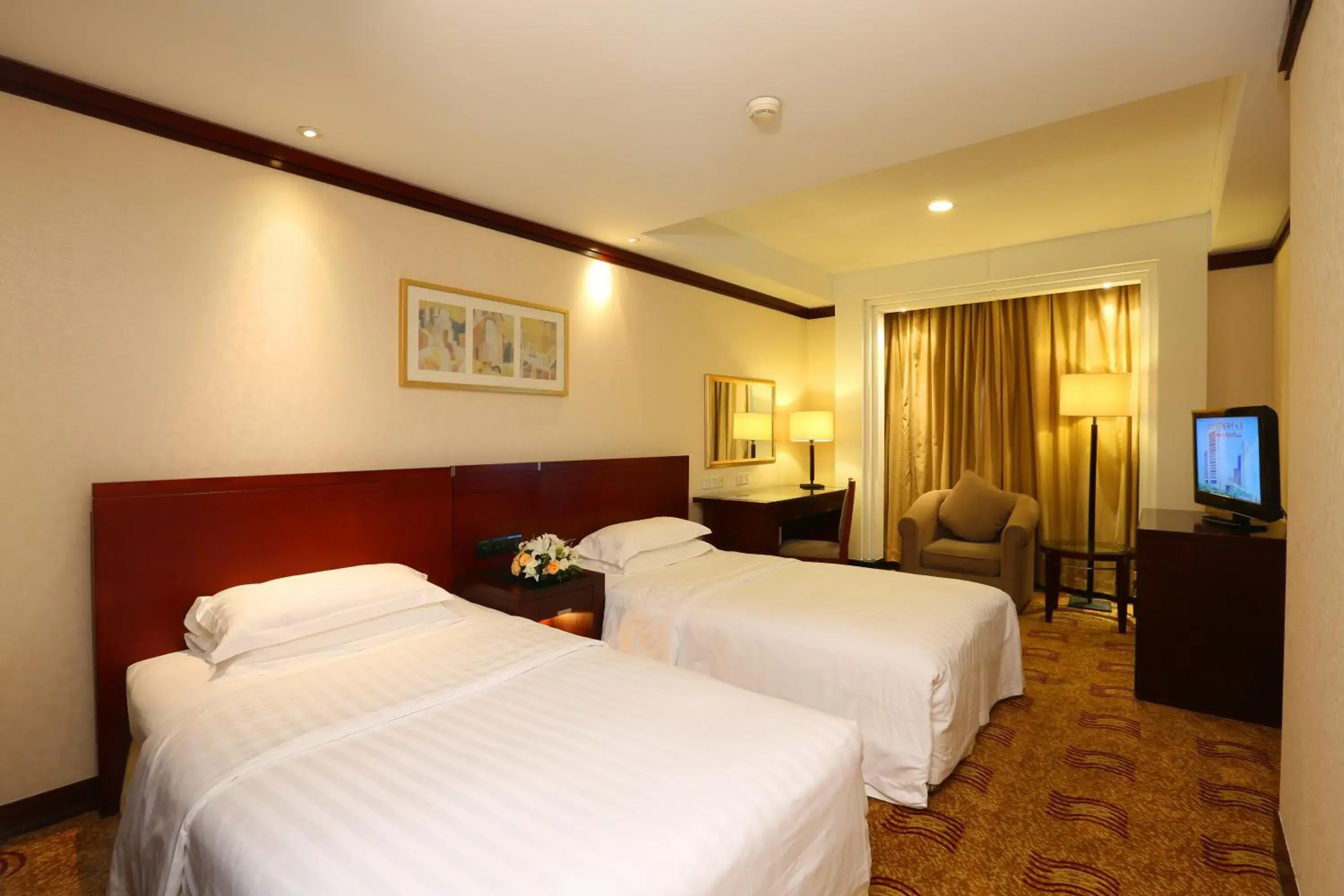 Bed in Poly Plaza Hotel