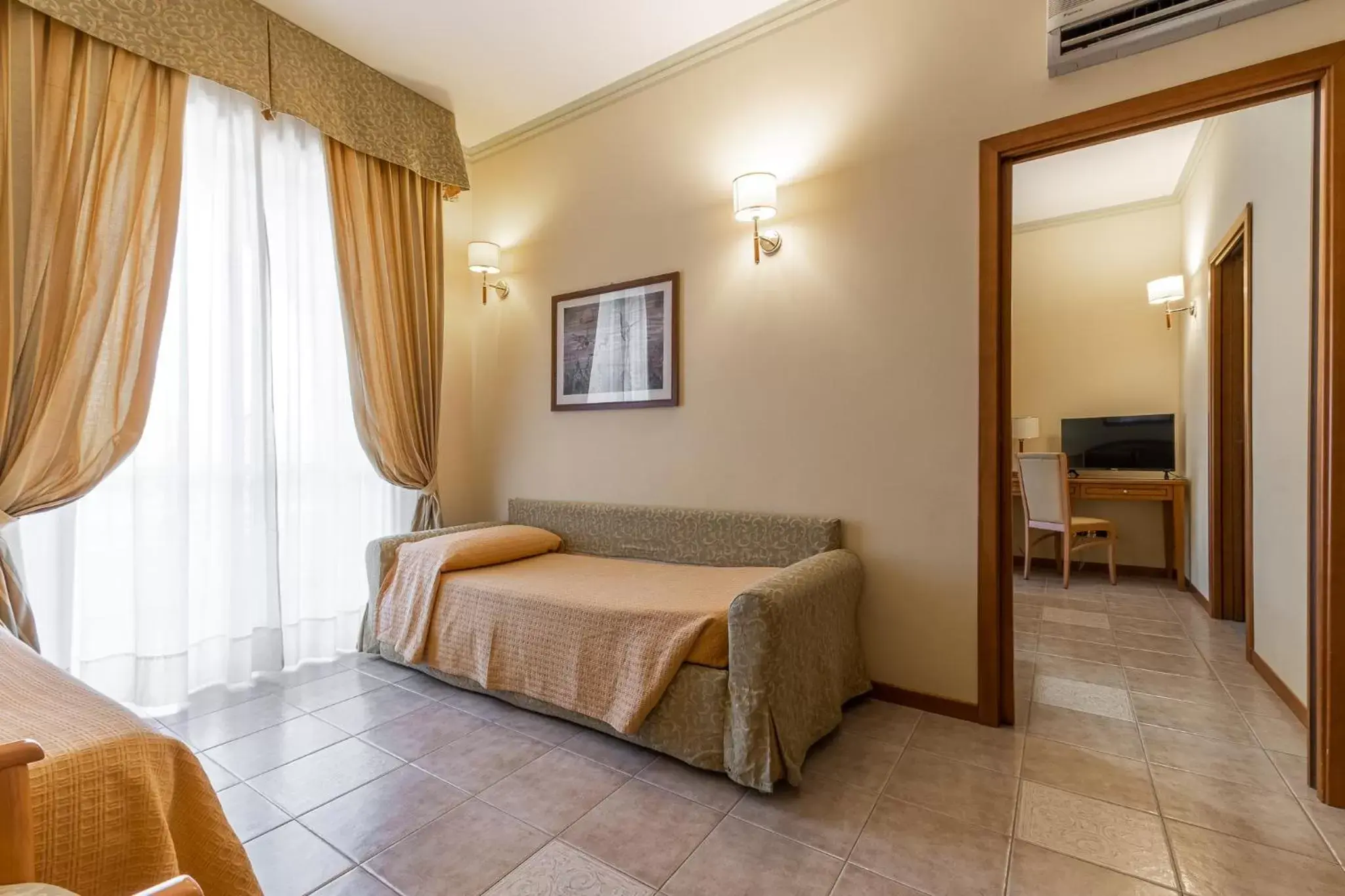 Bed, Seating Area in Hotel Relax