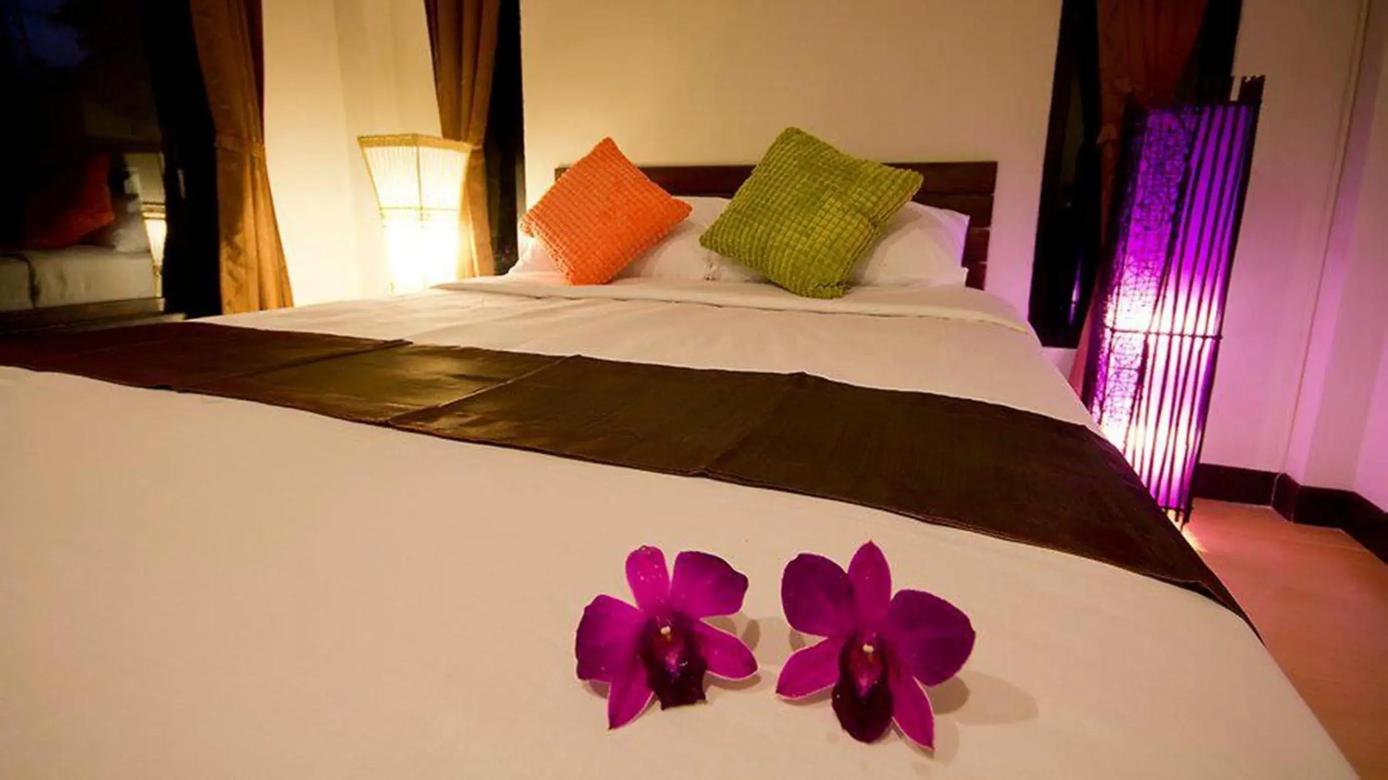 Bed in The Sylvana Pai Hotel