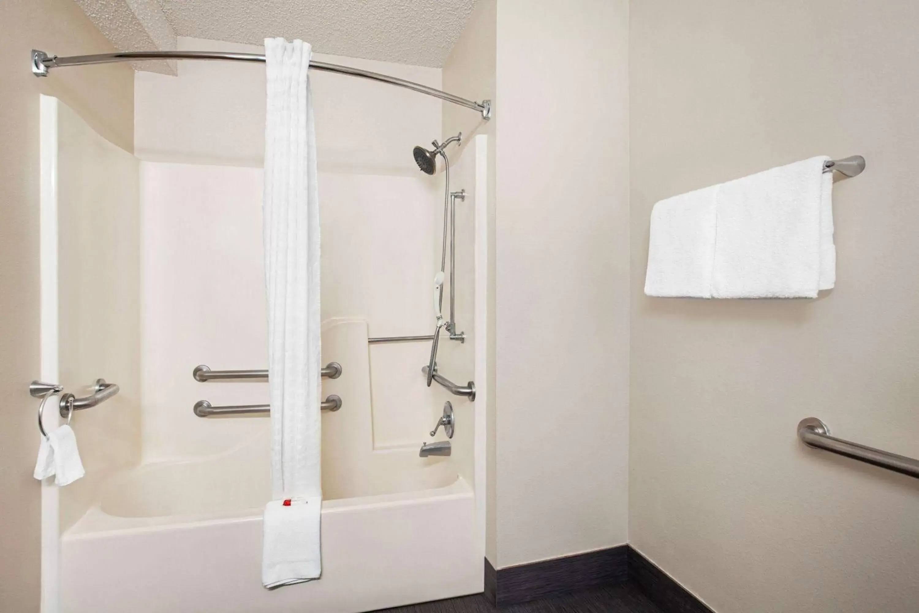 Bathroom in Super 8 by Wyndham Lenexa Overland Park Area/Mall Area
