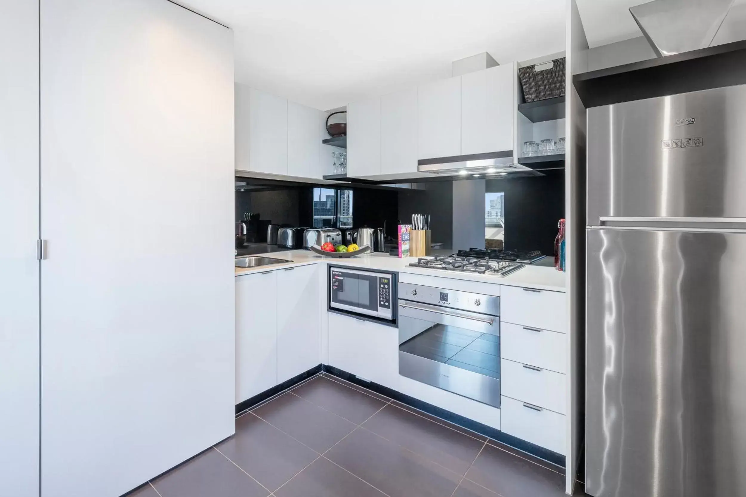 Kitchen or kitchenette, Kitchen/Kitchenette in Aura on Flinders Serviced Apartments