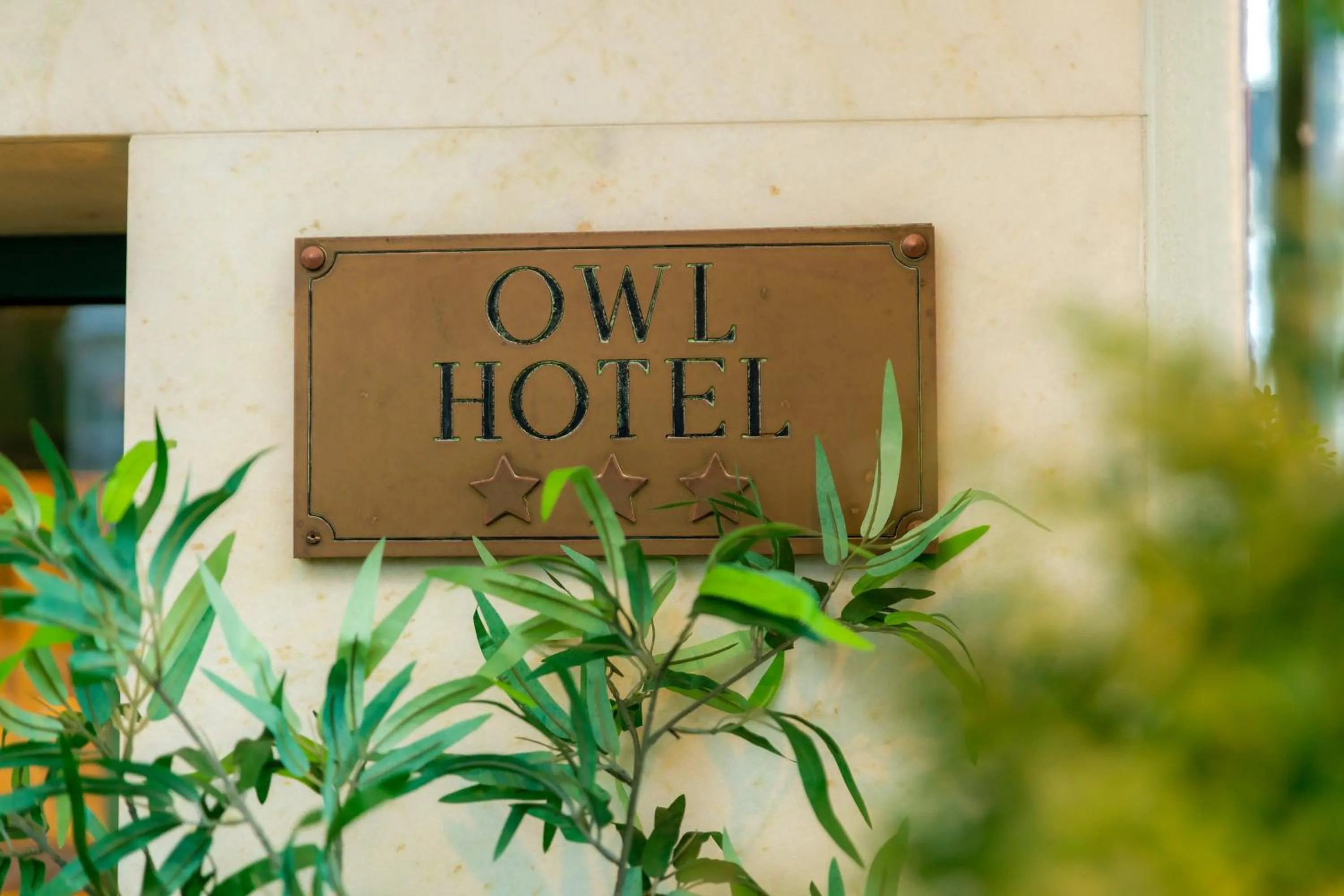 Property logo or sign in Owl Hotel