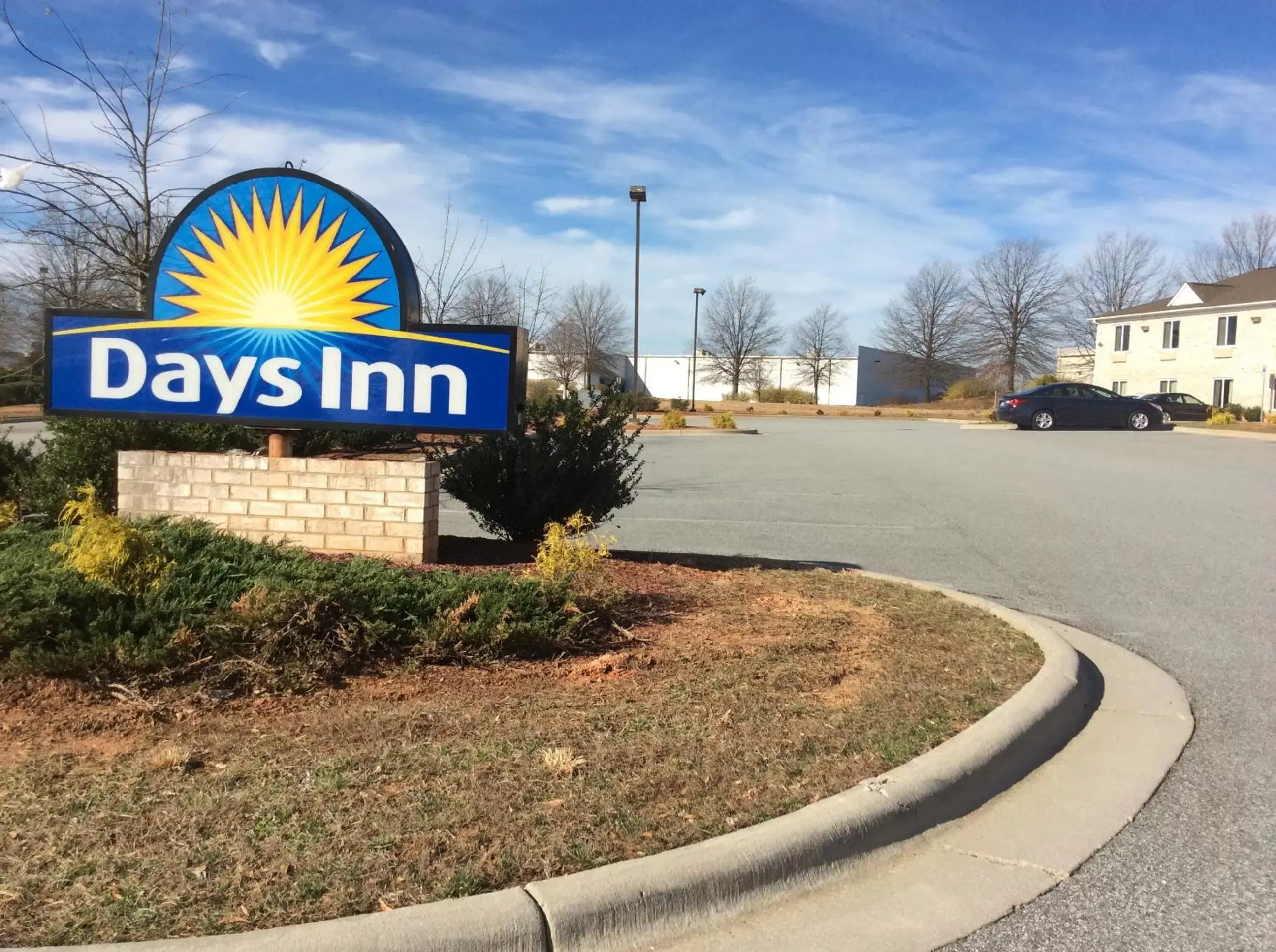 Property logo or sign in Days Inn by Wyndham Greensboro NC